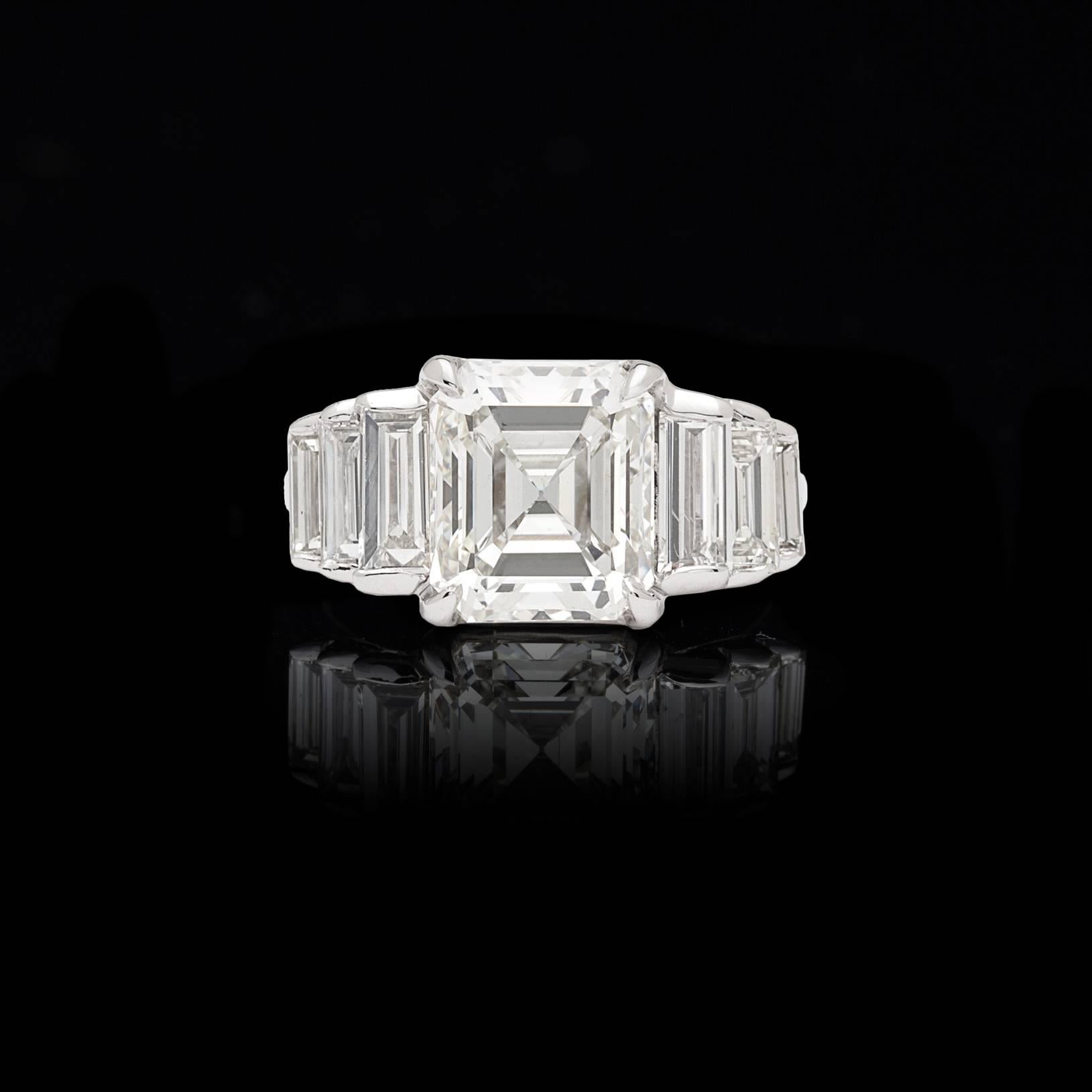 Looking for a showstopper? Then look no further! This gorgeous 18 karat white gold beauty features a remarkable 3.68 carat GIA graded Emerald Cut Diamond (J/VS1) flanked by 6 perfectly matched Baguette Cut Diamonds (3 on either side) for an