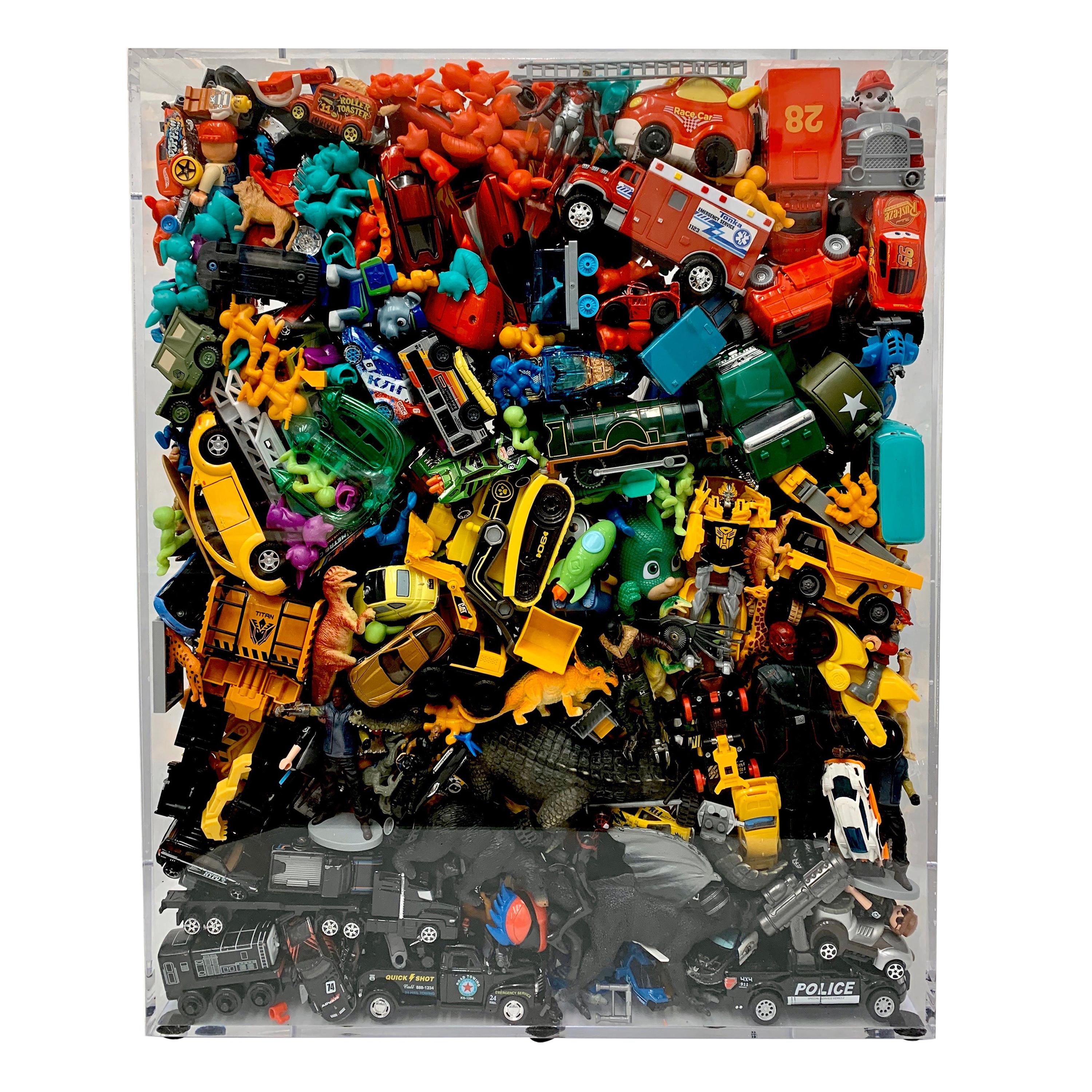 Phenomenal Collection of Toys Encased in a Lucite Box by J. Santamarina For Sale