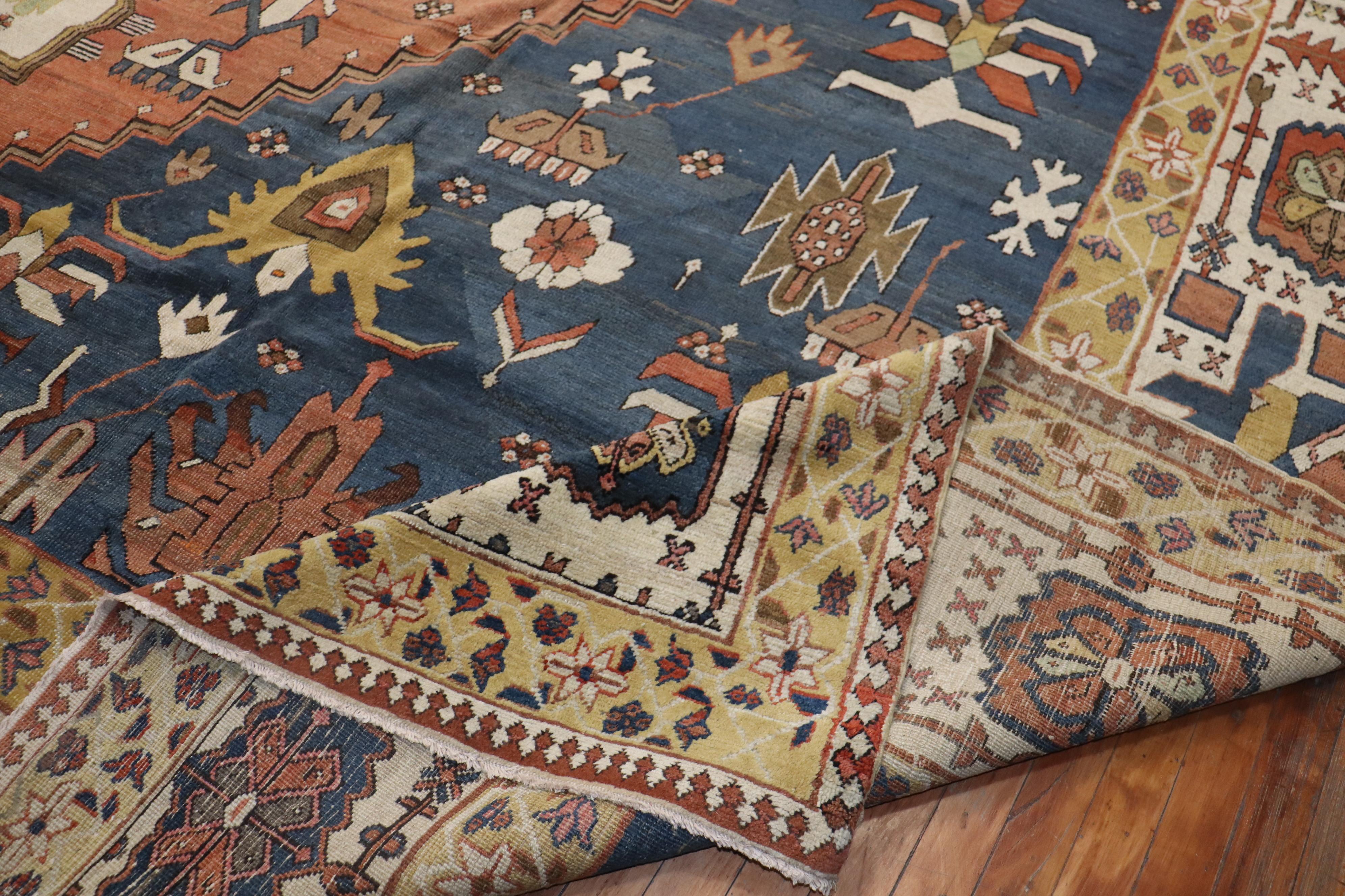 An amazing oversize late 19th century Tribal Persian Bakshaish rug. Bakshaish rugs are very rare to find in this size and exceptional condition. The geometric design is very common for rugs of this type. Background color is a soft denim blue, ivory