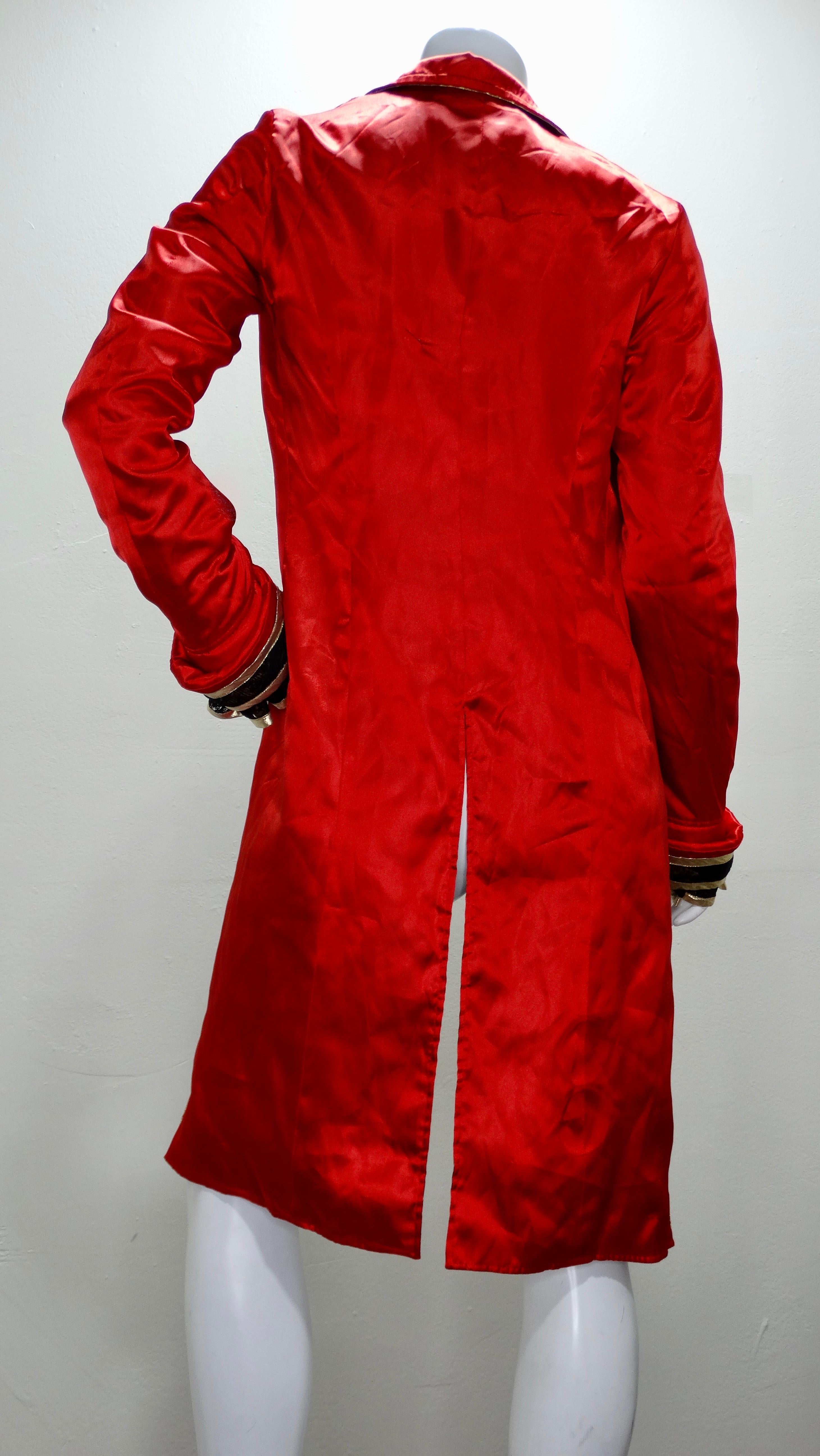 Add this streetwear piece to your collection! Circa mid 2000s, this Kimono tailcoat is designed by Takeshi Osumi for his streetwear brand Phenomenon. Jacket has a bright red exterior with a black lace and gold metalic trim and a printed interior