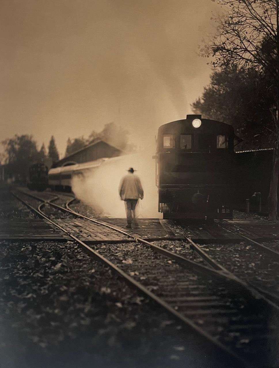 Phil Kember Black and White Photograph - In The Yard, Train Yard With Worker Sepia Toned