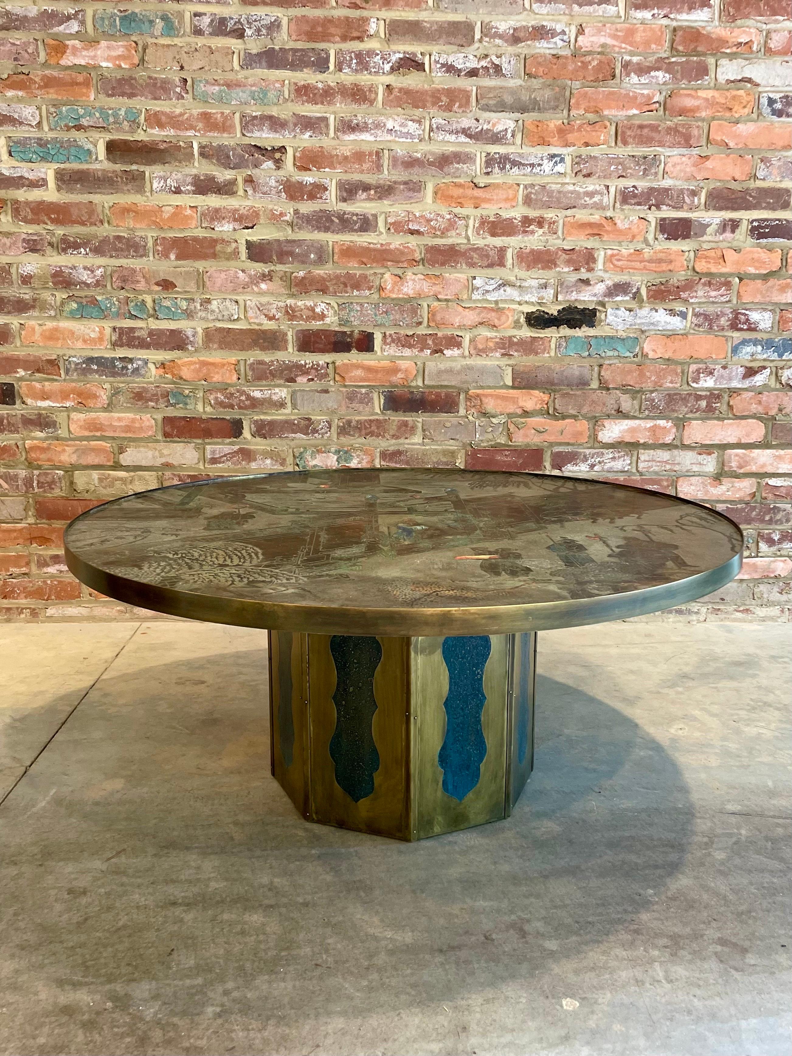 The Laverne Chan cocktail table showcases the ingenuity and creativity of father and son duo, Philip and Kelvin LaVerne. The table features a chinoiserie motif that is acid-etched into a bronze and pewter surface, giving it a unique and intricate