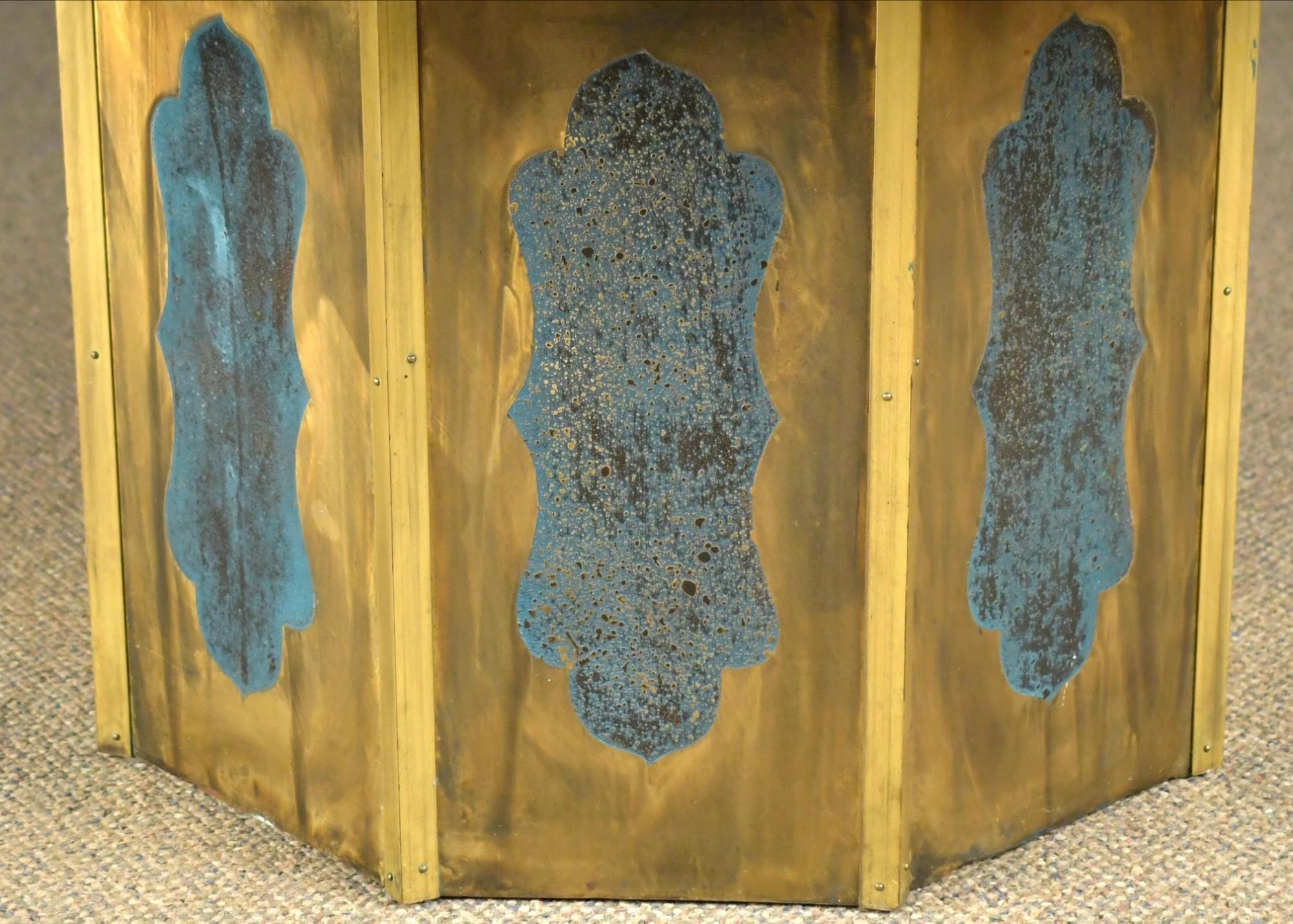A vintage Philip & Kelvin LaVerne 'Chan' coffee table, in patinated pewter and bronze with hand painted enamels of a Chinese landscape with figures, structures, horses and trees, elevated on a hexagonal pedestal with blue enameled panels. Signed on