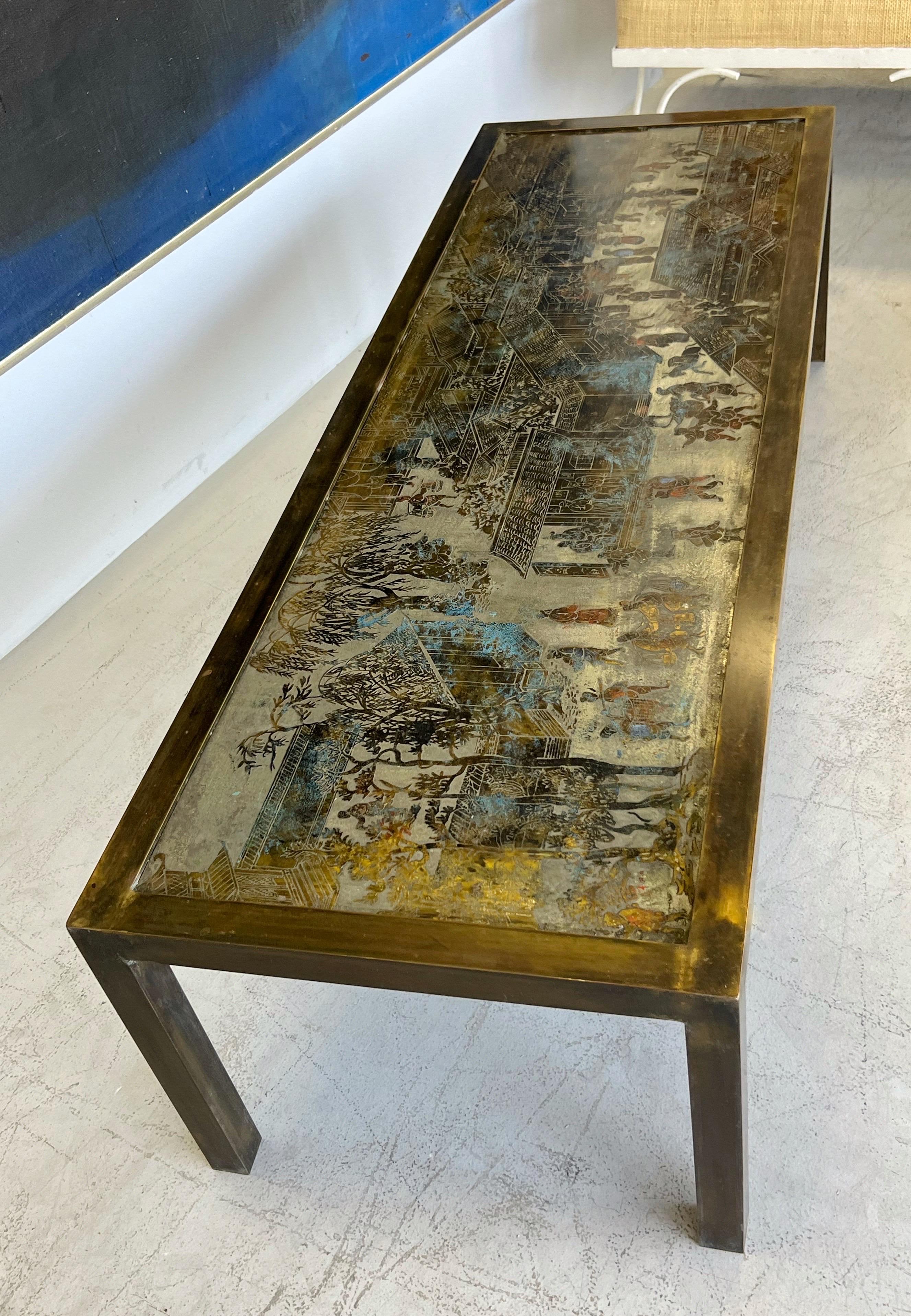 Coffee table by Philip and Kelvin Laverne. Modern angular design on the frame juxtaposed with their “Spring Festival” pattern. Great condition, original patina, retains the subtle yet colorful enamel accents. 
