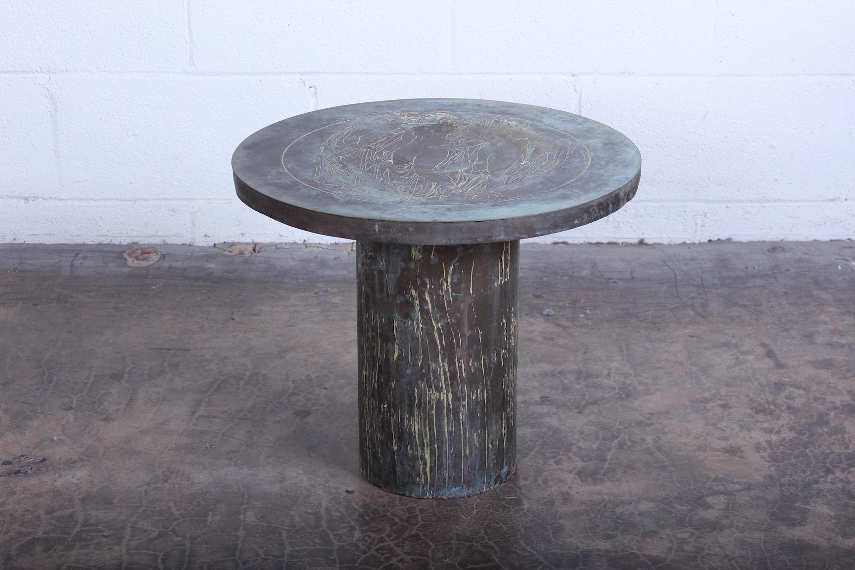 A beautifully patinated side table by Philip and Kelvin LaVerne.