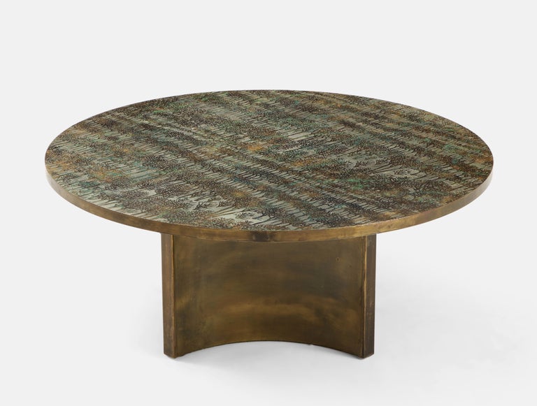 Philip and Kelvin LaVerne’s rare sculptural Eternal Forest coffee table with circular top hand-crafted of acid-etched and patinated bronze over wood with patinated pewter and delicate tones of hand-painted polychrome enamels resting on a four star