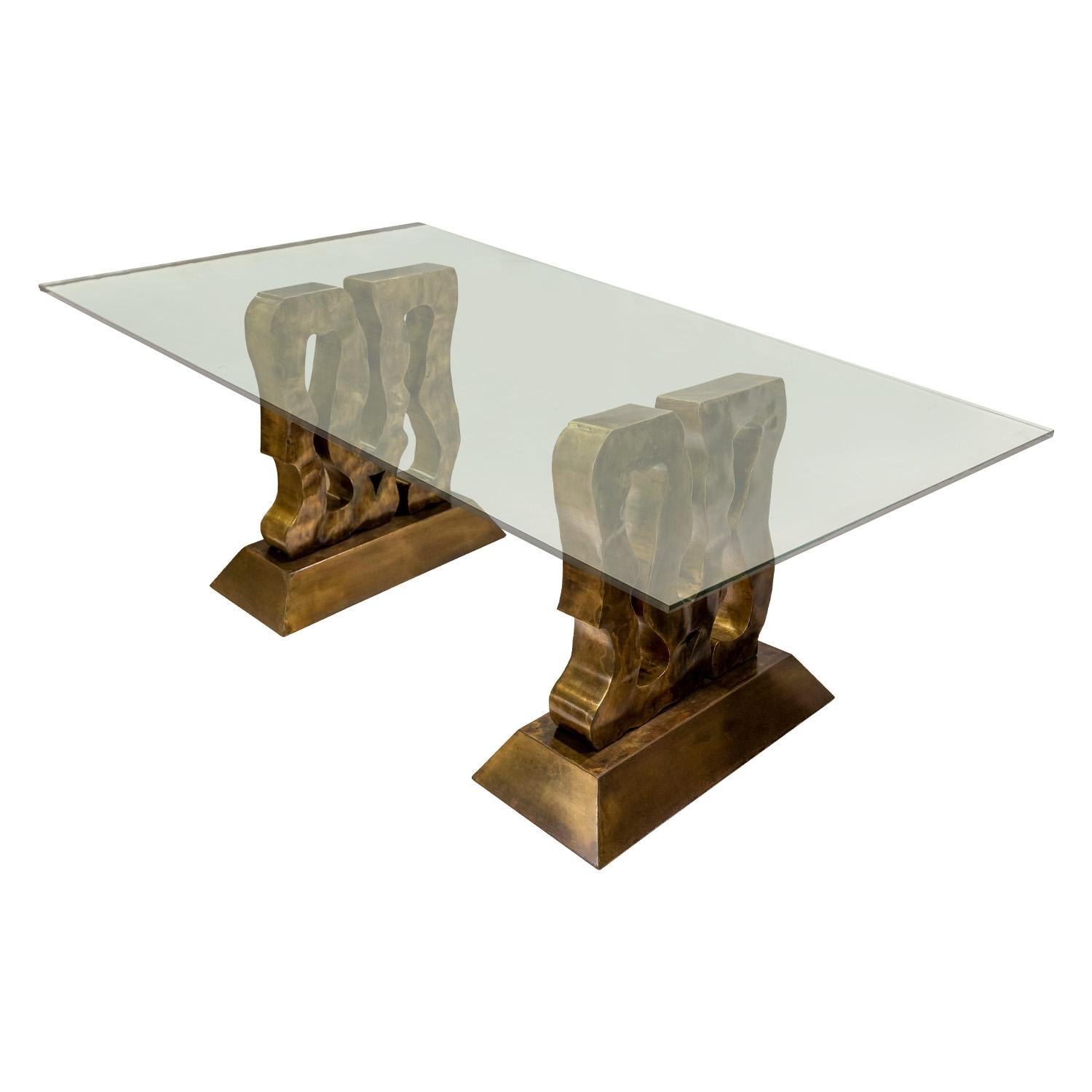 Stunning and unique “Abstract #1” dining table with 2 hand-brazed abstract sculpture bases in patinated bronze with a thick glass top by Philip & Kelvin LaVerne, American 1980's (engraved “Philip Kelvin LaVerne” in metal and original gallery label