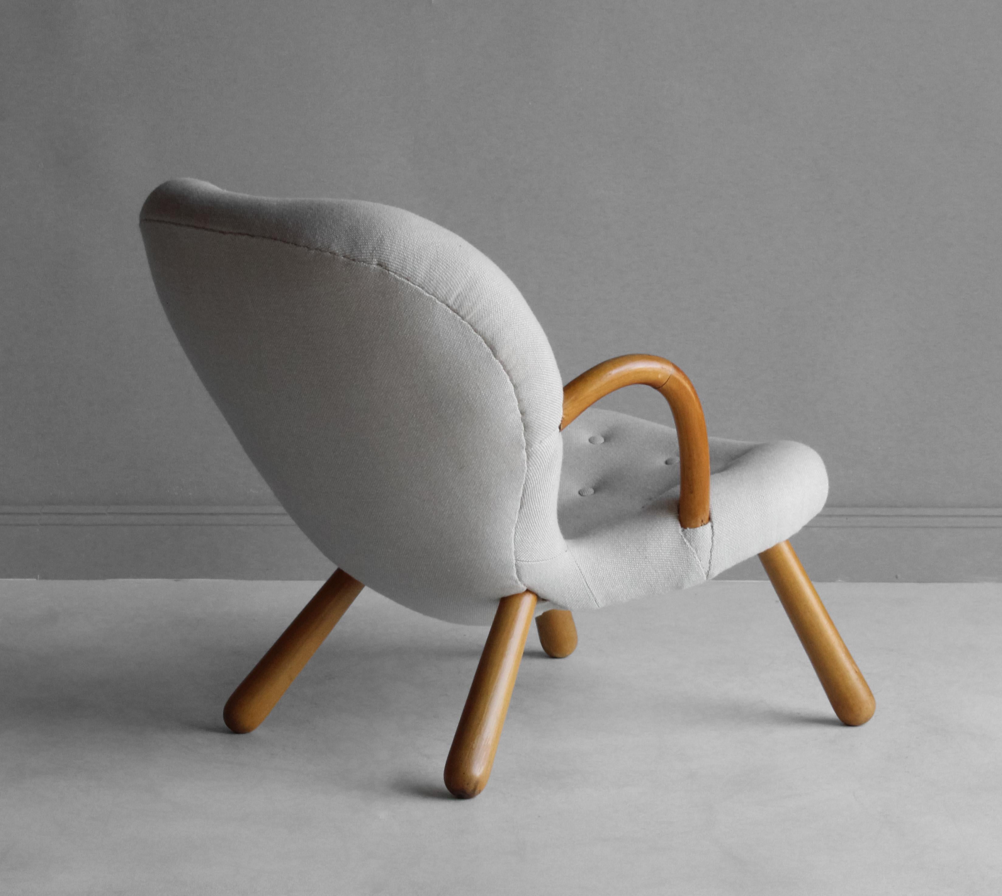 An organic Arnold Madsen lounge chair or clam chair. Stained beech frame, upholstered in traditional Scandinavian fabric.

Other 20th century designers working in the organic style include Flemming Lassen, Gio Ponti, Vladimir Kagan, Jean Royere, and
