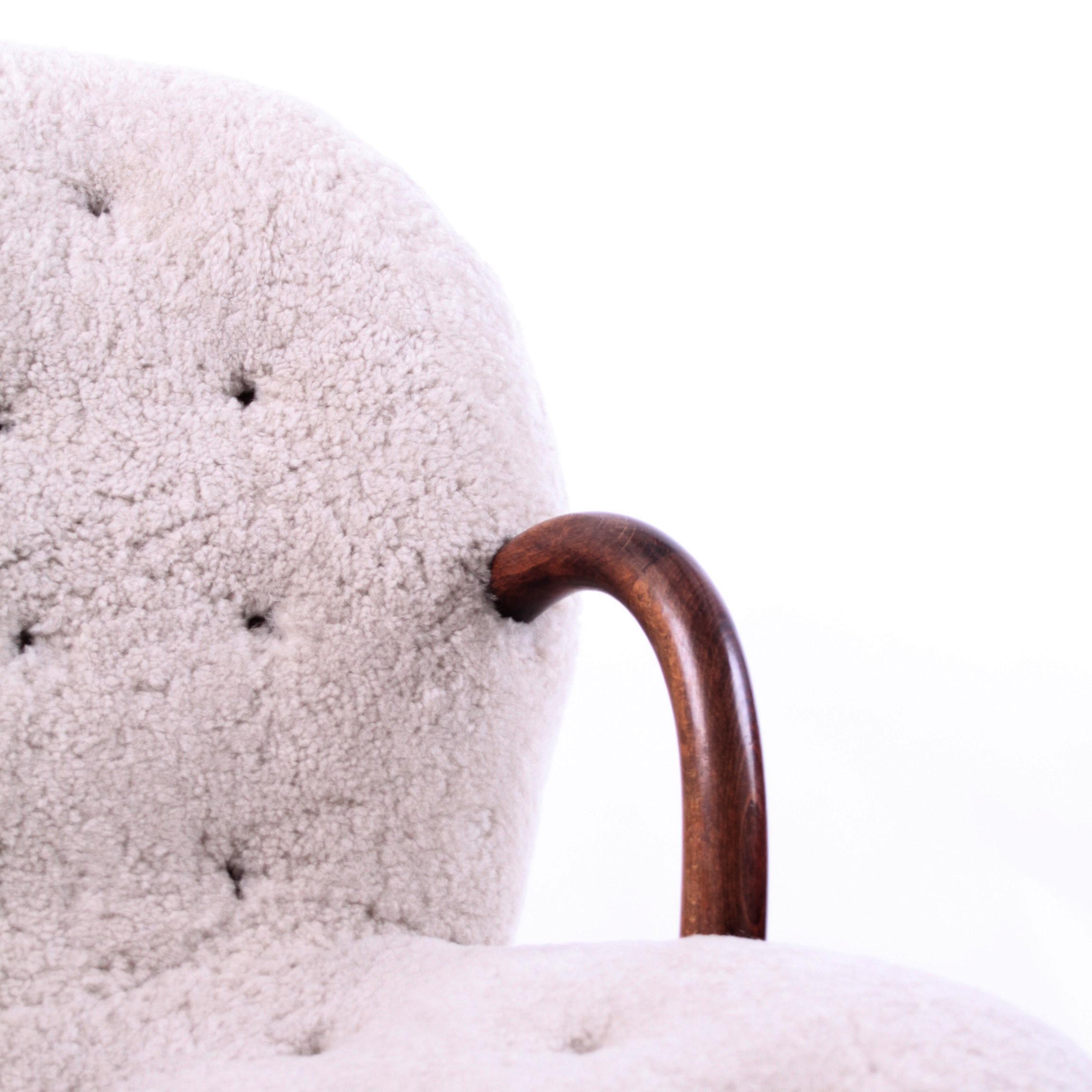 Stained Philip Arctander Clam Chair in Off-White Sheep Skin and Leather Buttons