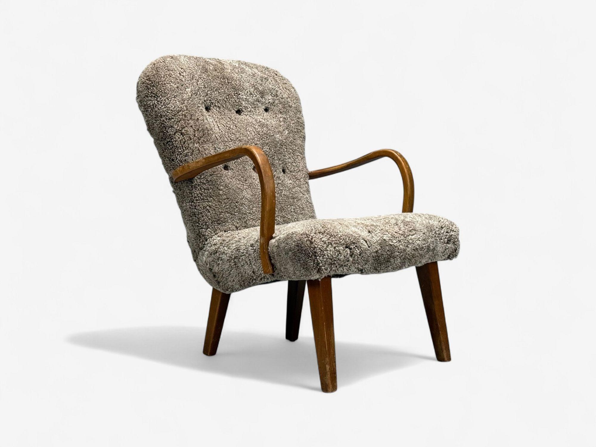 Philip Arctander Style, Danish Mid-Century Modern, Sheepskin, Beech, Lounge or Arm Chair, Denmark, 1960s

An organic modern lounge chair after Philip Arctander, designed and produced in Denmark c. 1960s. This example features exposed beech legs and