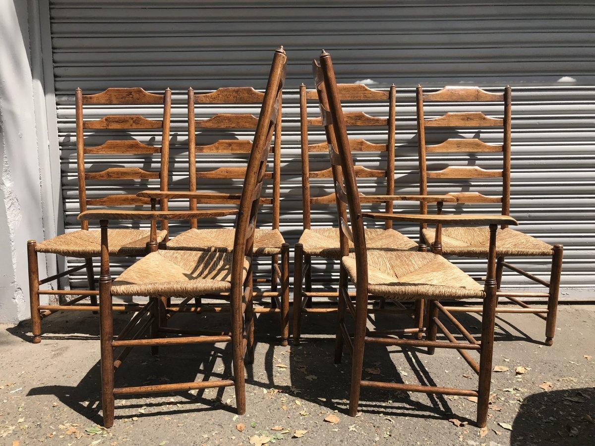 An original set of six Arts & Crafts ash ladder back rush seated chairs by Philip Clissett

Two armchairs and four chairs, circa 1910.
Armchairs measure: Height 45 1/2 inches, width 23 1/2
