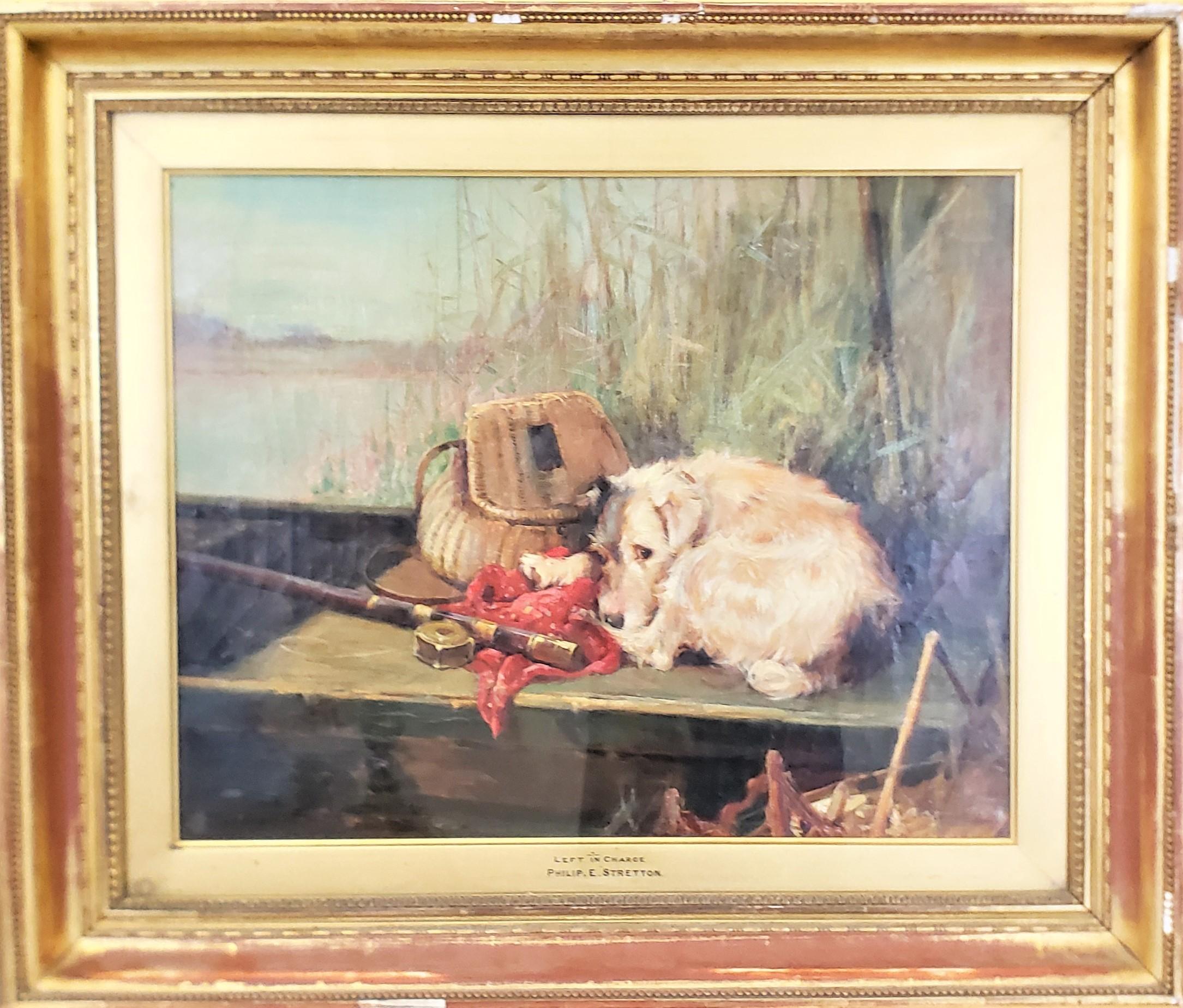 This antique painting was dome by the very well known Philip Eustice Stretton of England in approximately 1900 in the period Victorian style. This original painting is done with oil on canvas and depicts a small terrior curled up with a fly fishing