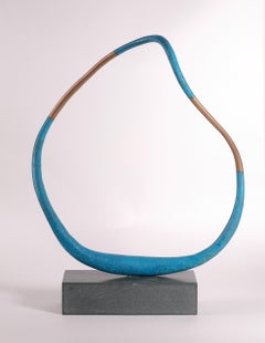 Acanto V - Oxidised Blue Bronze sculpture rotating on a Cumbrian slate base