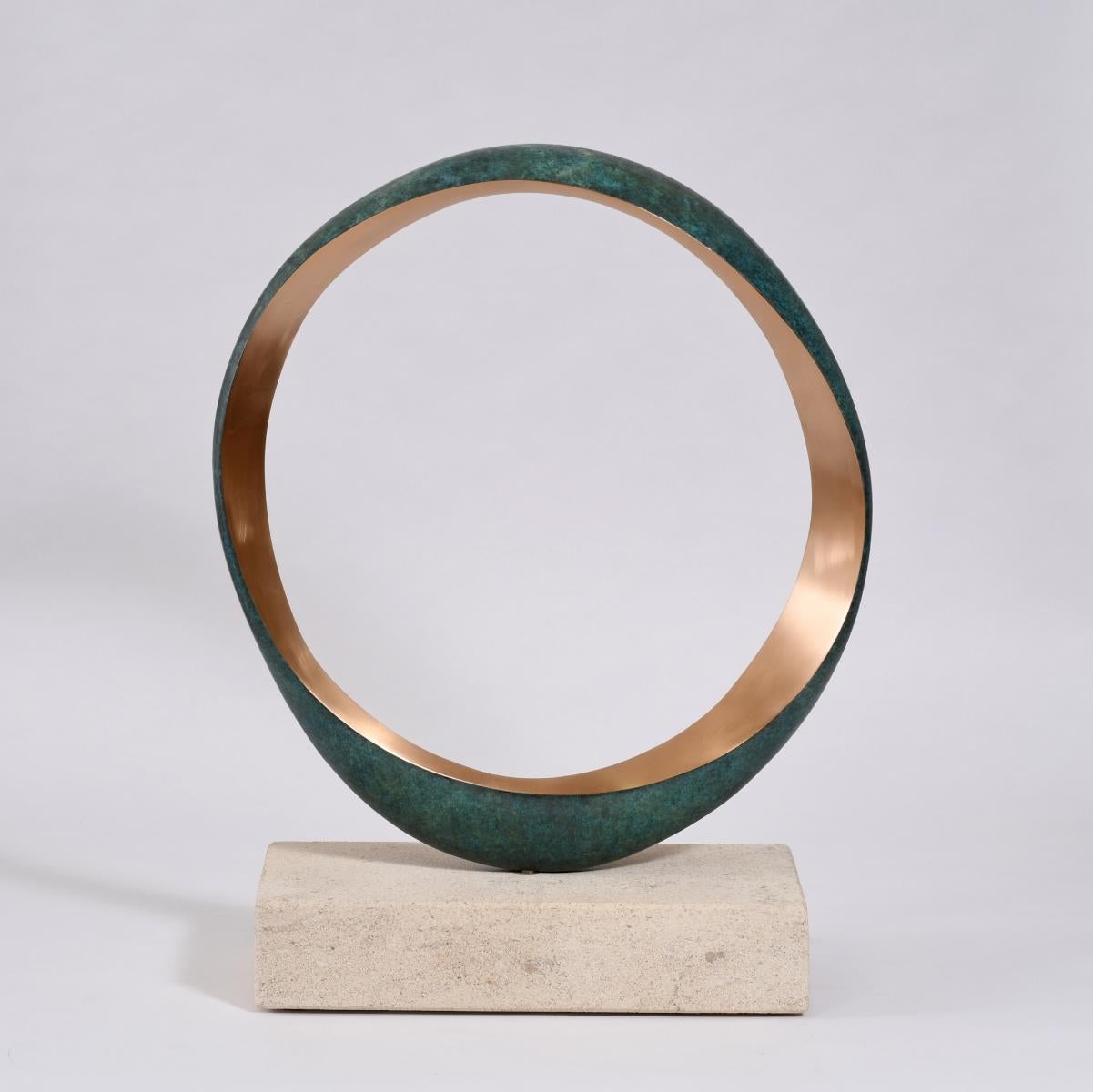 Bronze rotating on a Bath stone base.
Stamped with monogram signature and uniquely numbered 543, 1/9
Series of 9 variations.
The inner edges show natural bronze.  Finished to a smooth satin on one face the other has a spattered translucent
