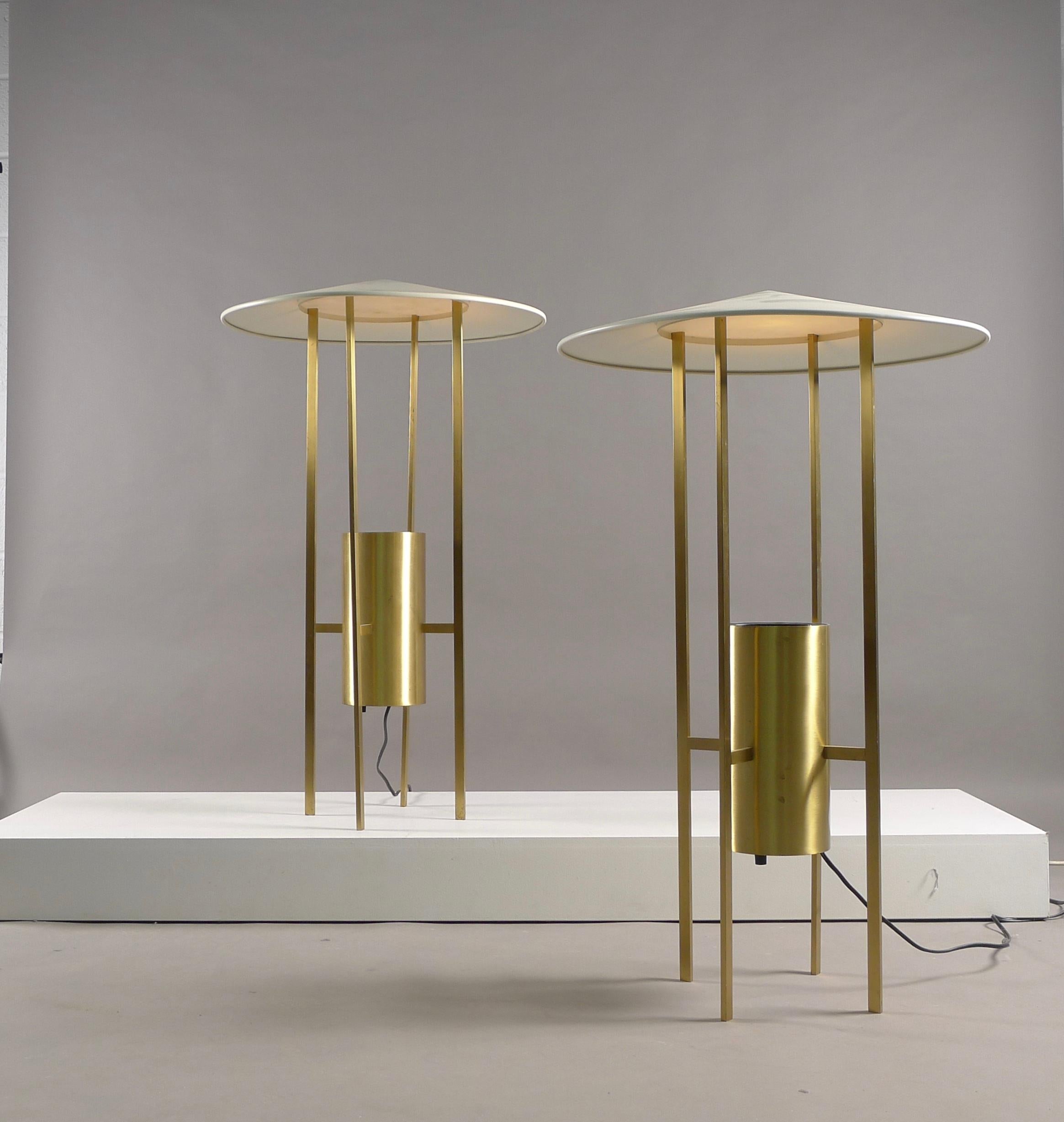 Philip Johnson and Richard Kelly for Edidson Price, designed in 1953. A pair of floor lamps of brass framework supporting enameled metal shade. Switched from beneath the light canister with a dimmable switch.
Both lamps have original labels to the