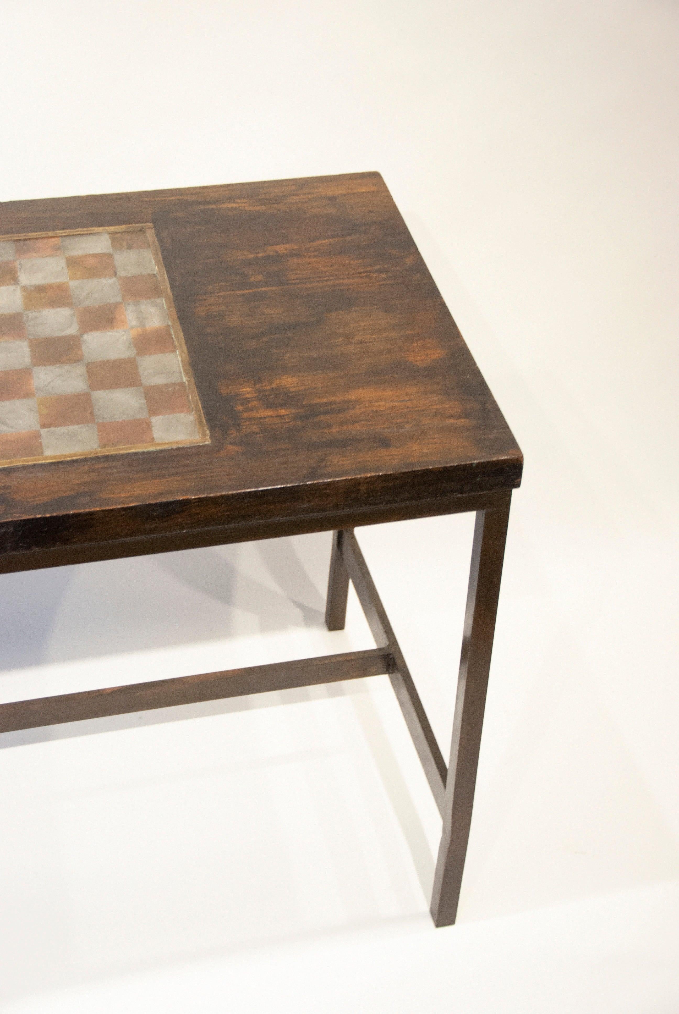 Philip and Kelvin LaVerne

Game table
Measures: Wood, pewter and bronze, circa 1970s
28 1/2” H x 38” W x 22” D
(72.39cm x 97cm x 55.88cm)

Philip and Kelvin LaVerne are an American collaborative-design father and son duo. They are best known