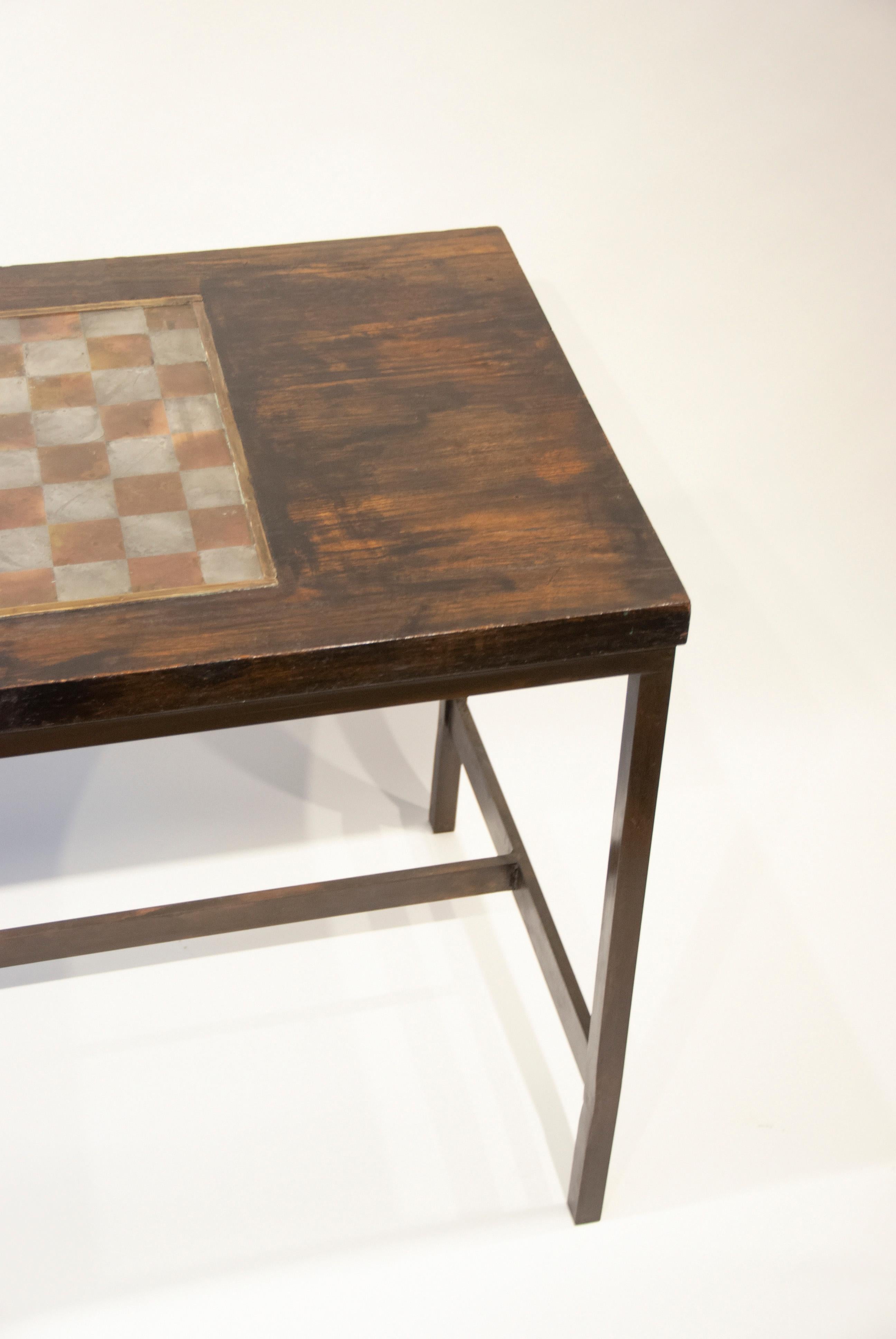 Philip and Kelvin LaVerne

Game table

Wood, pewter and bronze, circa 1970s
Measures: 28 1/2” H x 38” W x 22” D
(72.39cm x 97cm x 55.88cm)

Philip and Kelvin LaVerne are an American collaborative-design father and son duo. They are best