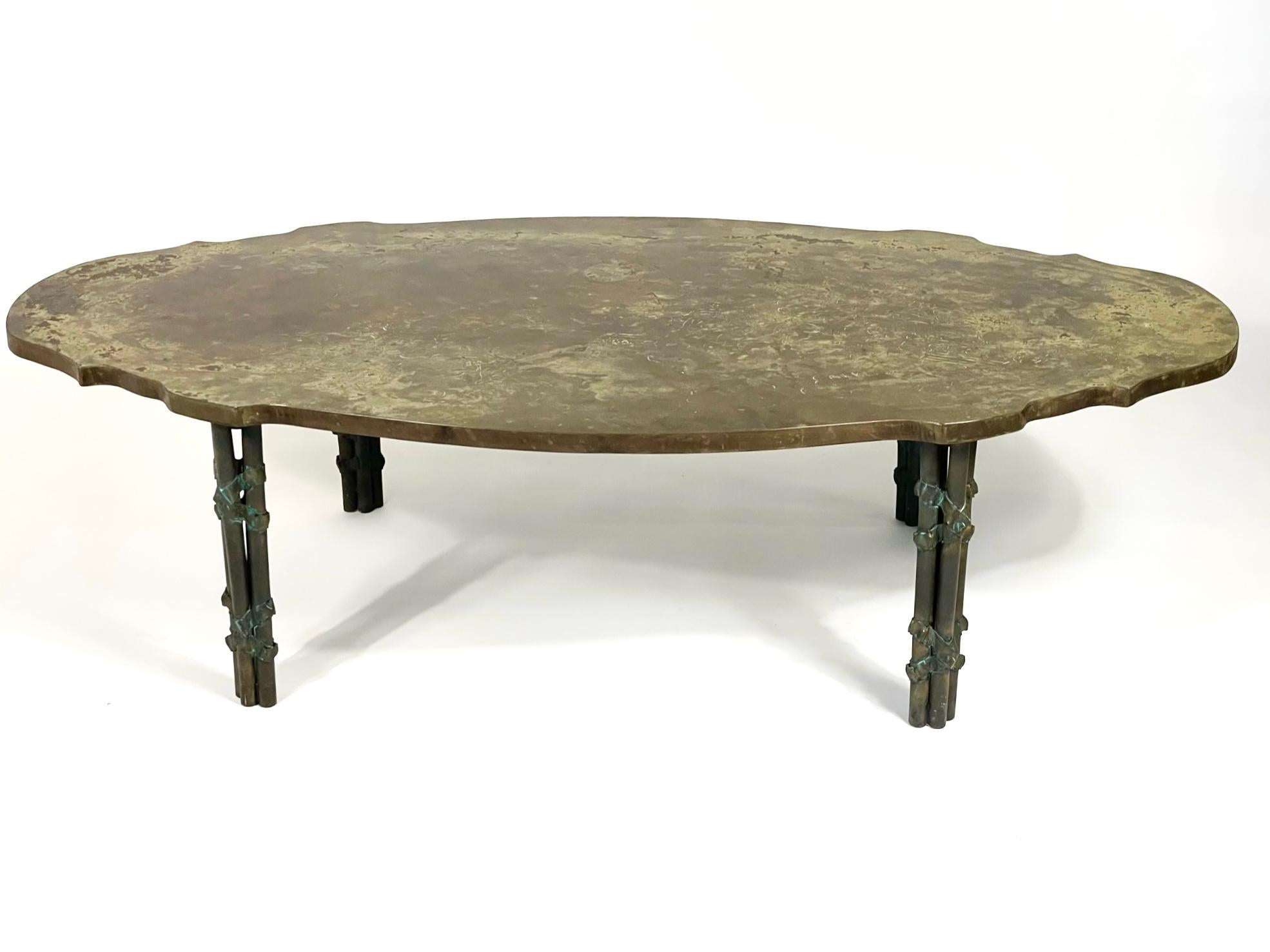 This Boucher Coffee Table was designed by Philip and Kelvin Laverne in the 1960s. According to the catalog it is comprised of three separate bronzes inlaid by hand to create one solid bronze background of magnificent light and dark golden brown