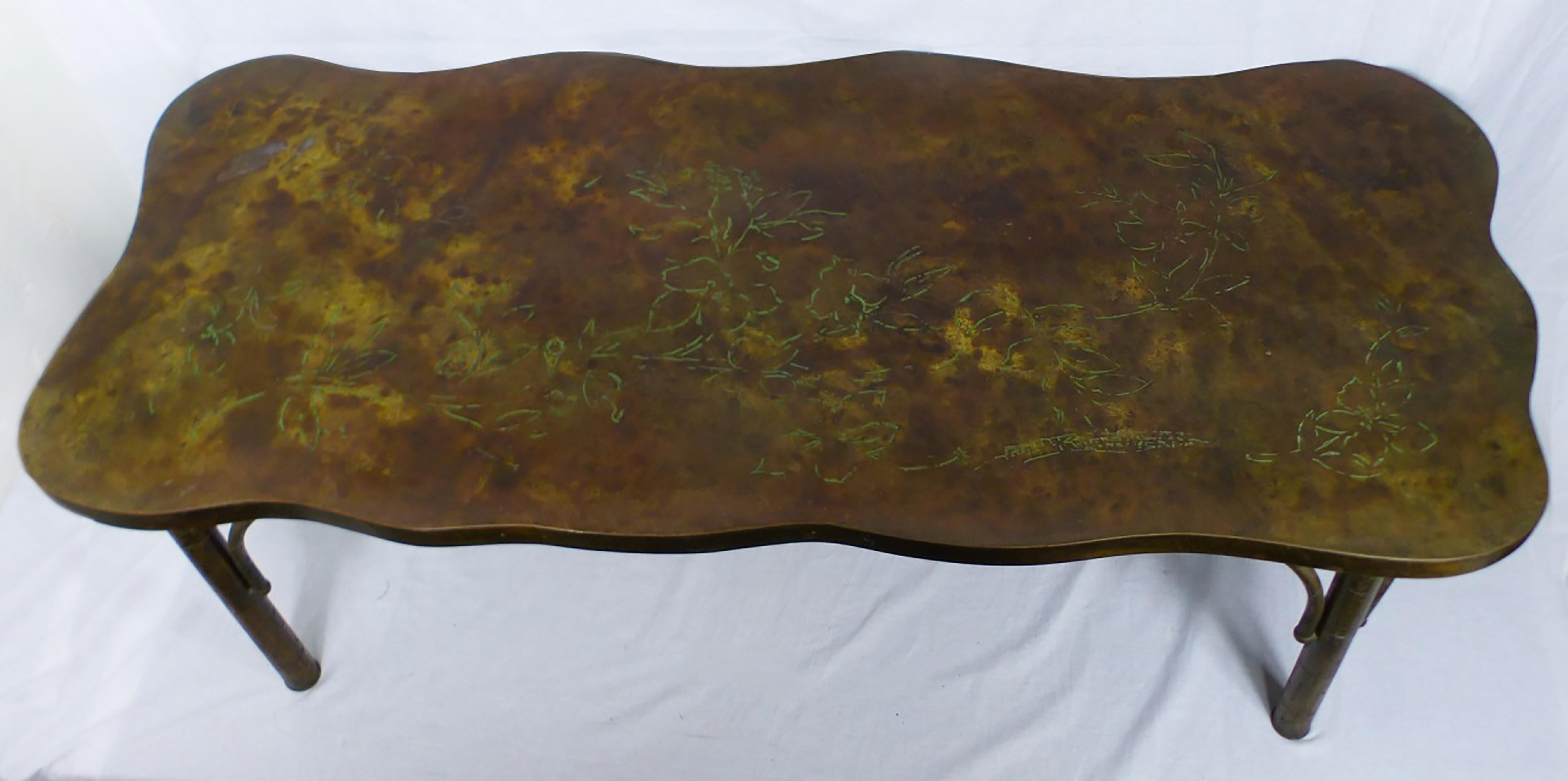 Philip and Kelvin Laverne midcentury cocktail table, with a scalloped top incised with Verdigris floral branches on a burnished metal ground. Signed to top. Measures 54 1/4