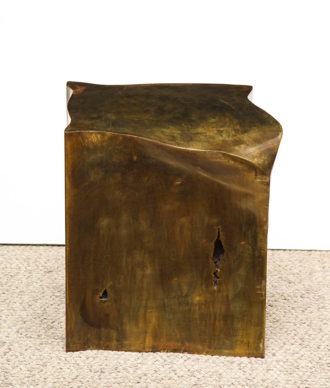 Studio built cube by Philip & Kelvin LaVerne. Sculptural cube that can be used at a side table. Welded form with irregular surfaces and crevices. Torched and oxidized finish to top. A very rare piece. Signed on top of side edge.