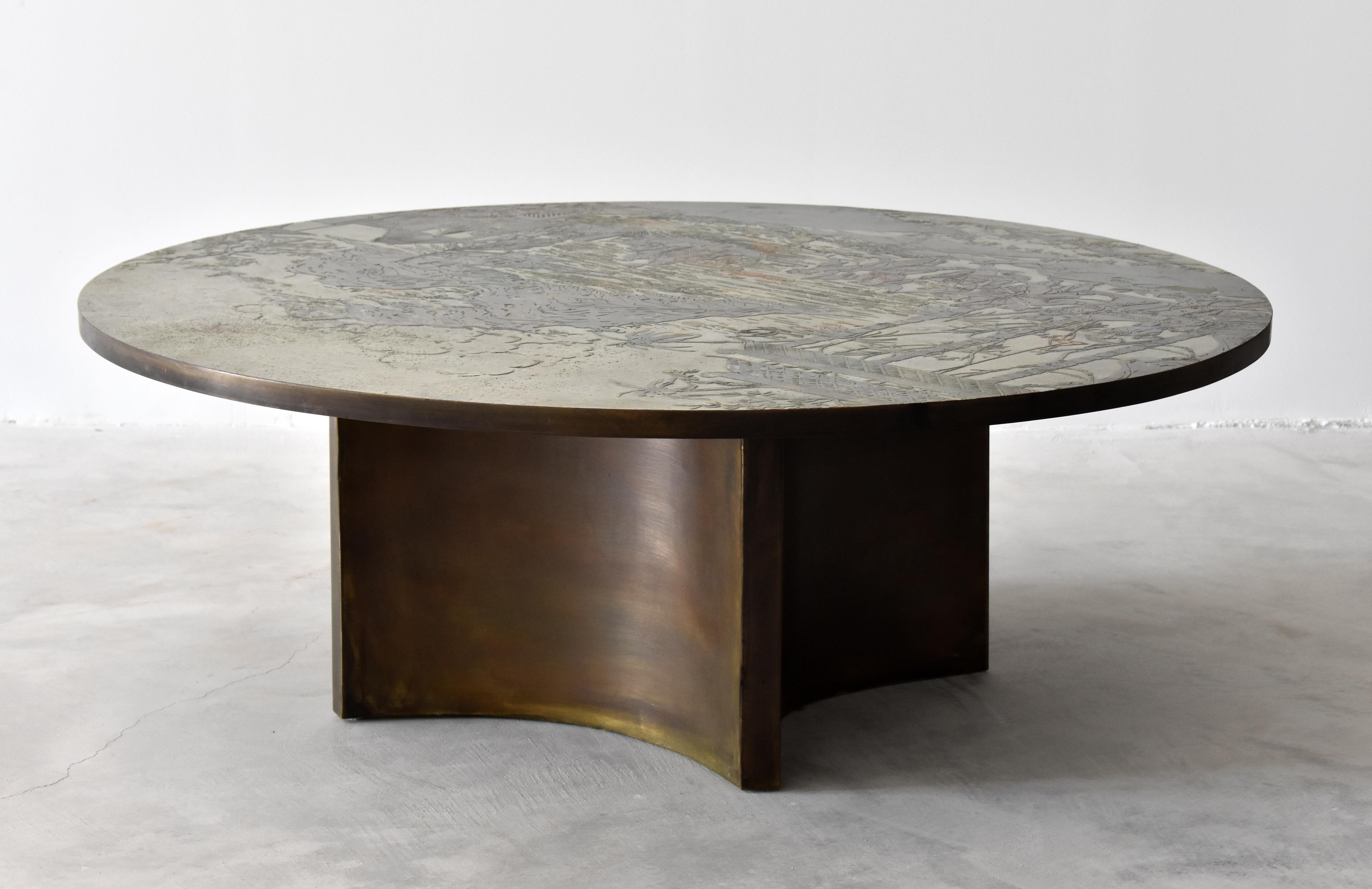 A rare and possibly custom ordered round coffee table / cocktail table by Philip & Kelvin LaVerne. The top has an Asian motif similar to that of the 