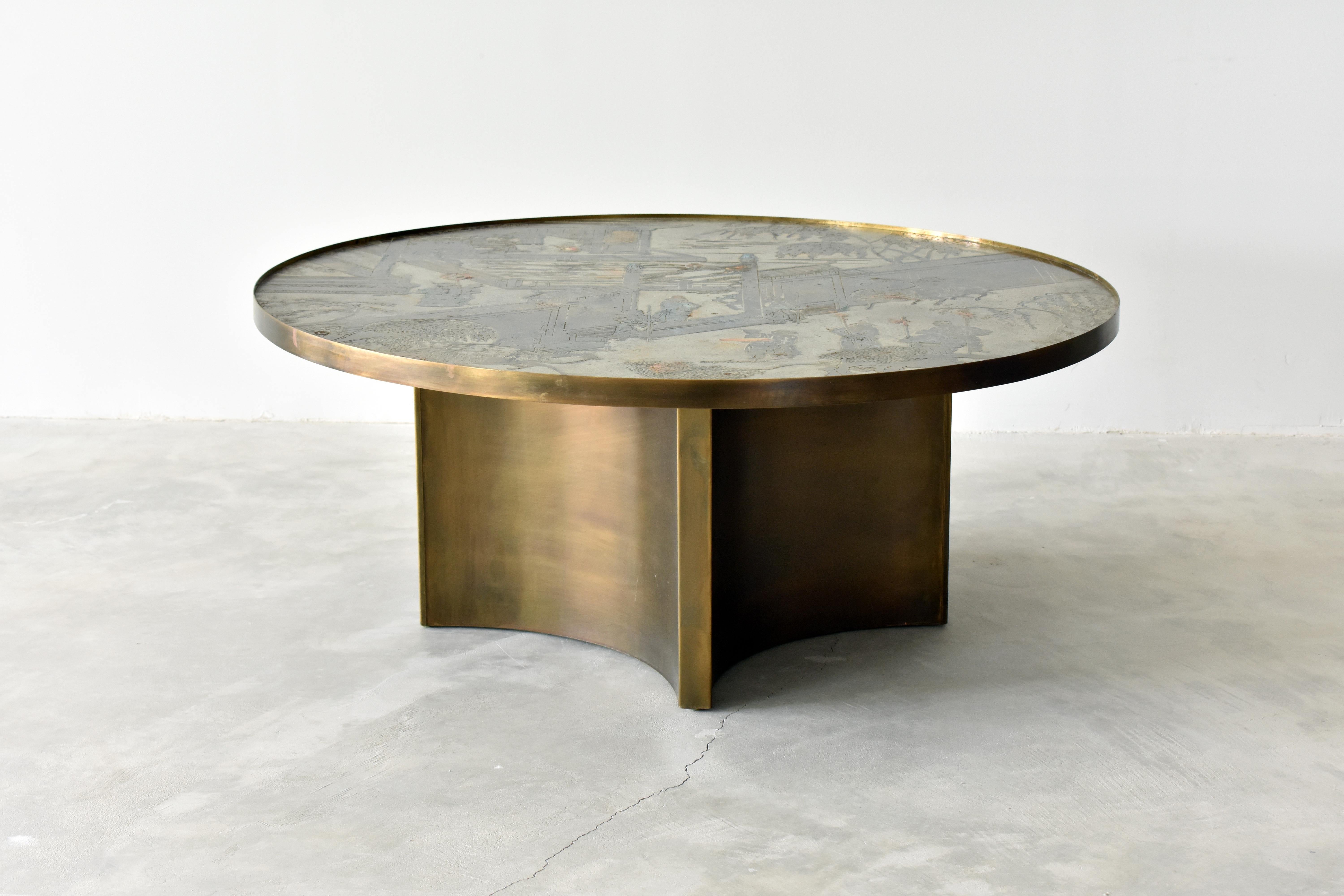 A rare and possibly custom ordered round coffee table or cocktail table by Philip & Kelvin LaVerne. The top bears the motif of the 