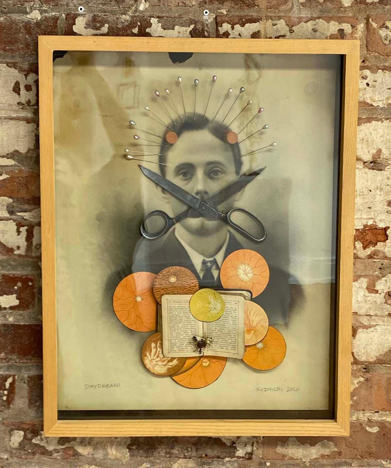One of a kind mixed-media collage on canvas by Philip Kuznicki from the Spirit exhibition. Comes in its original frame.
Born in Dunkirk NY, Kuznicki started his career working for artists such as Zaha Hadid and Ulysses Pagliari. His work is also a