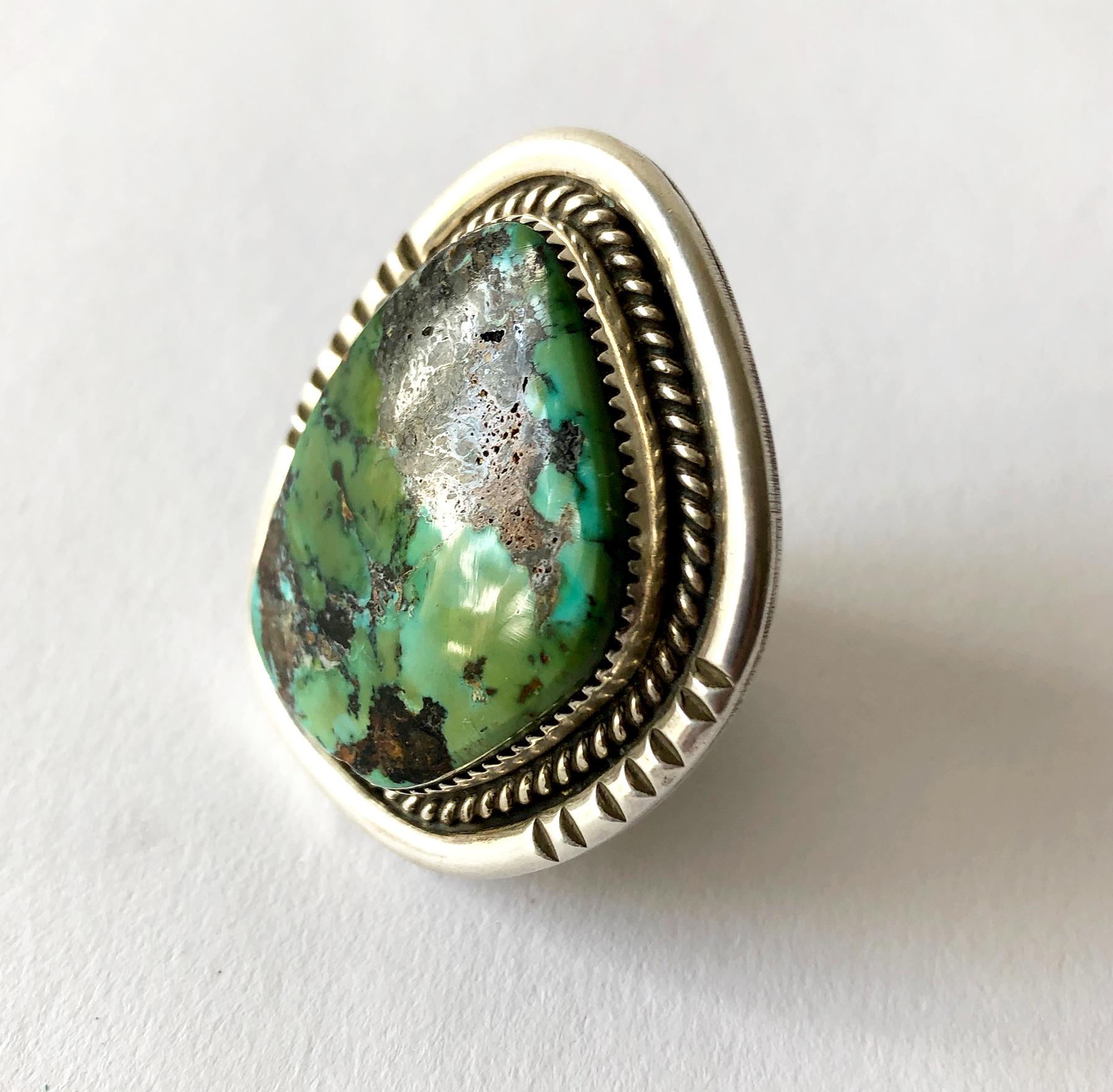 Hefty sterling silver and turquoise ring by Native American jeweler Philip Morse.  Ring is a finger size 11.5 - 12, the face of the ring measures 1.75
