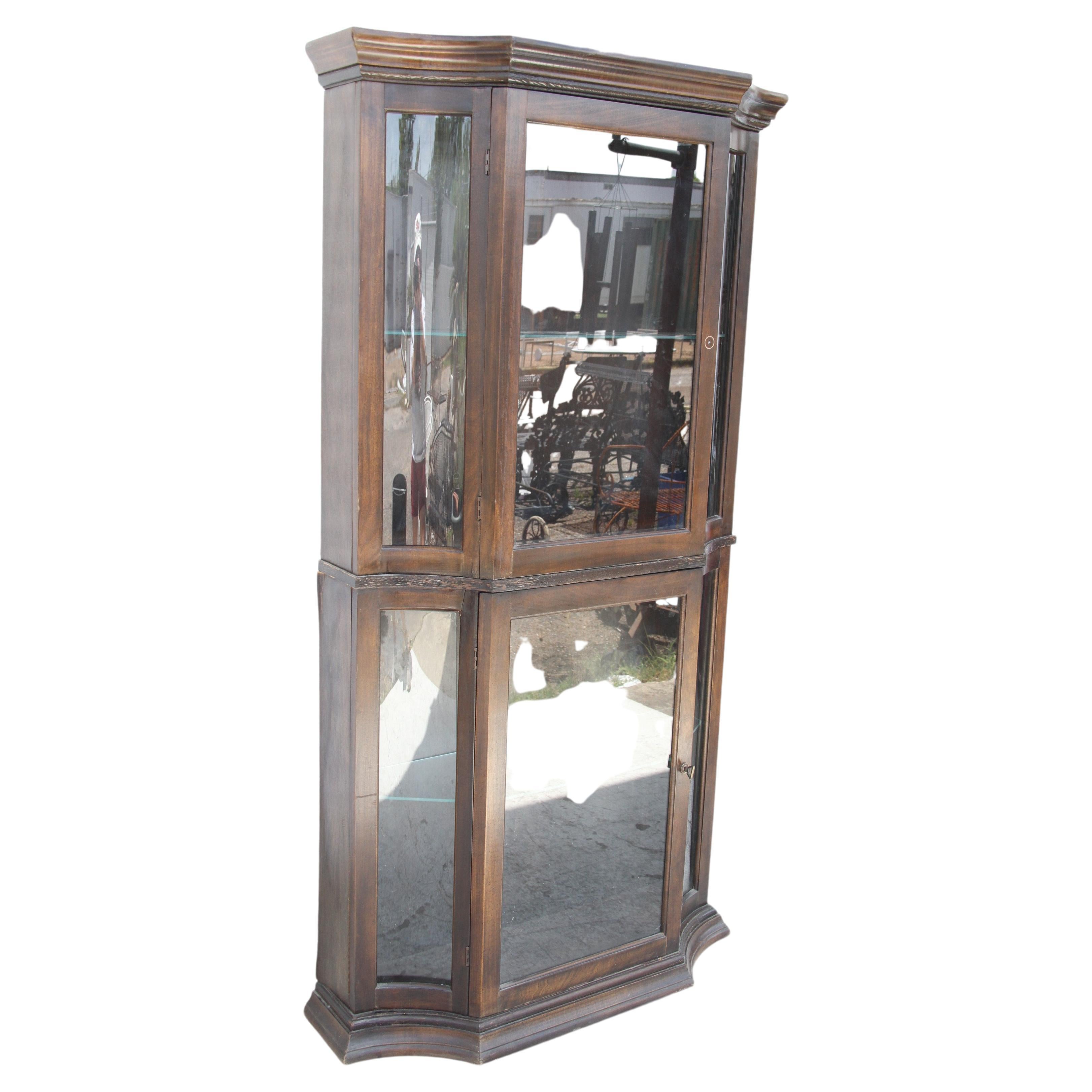 Regency China Display Cabinet by Philip Reinisch

A tall elegant glass display cabinet by Reinisch CO, Circa 1970s. Illuminated at top. 
Ample storage for collectibles with 3 shelves. 

34