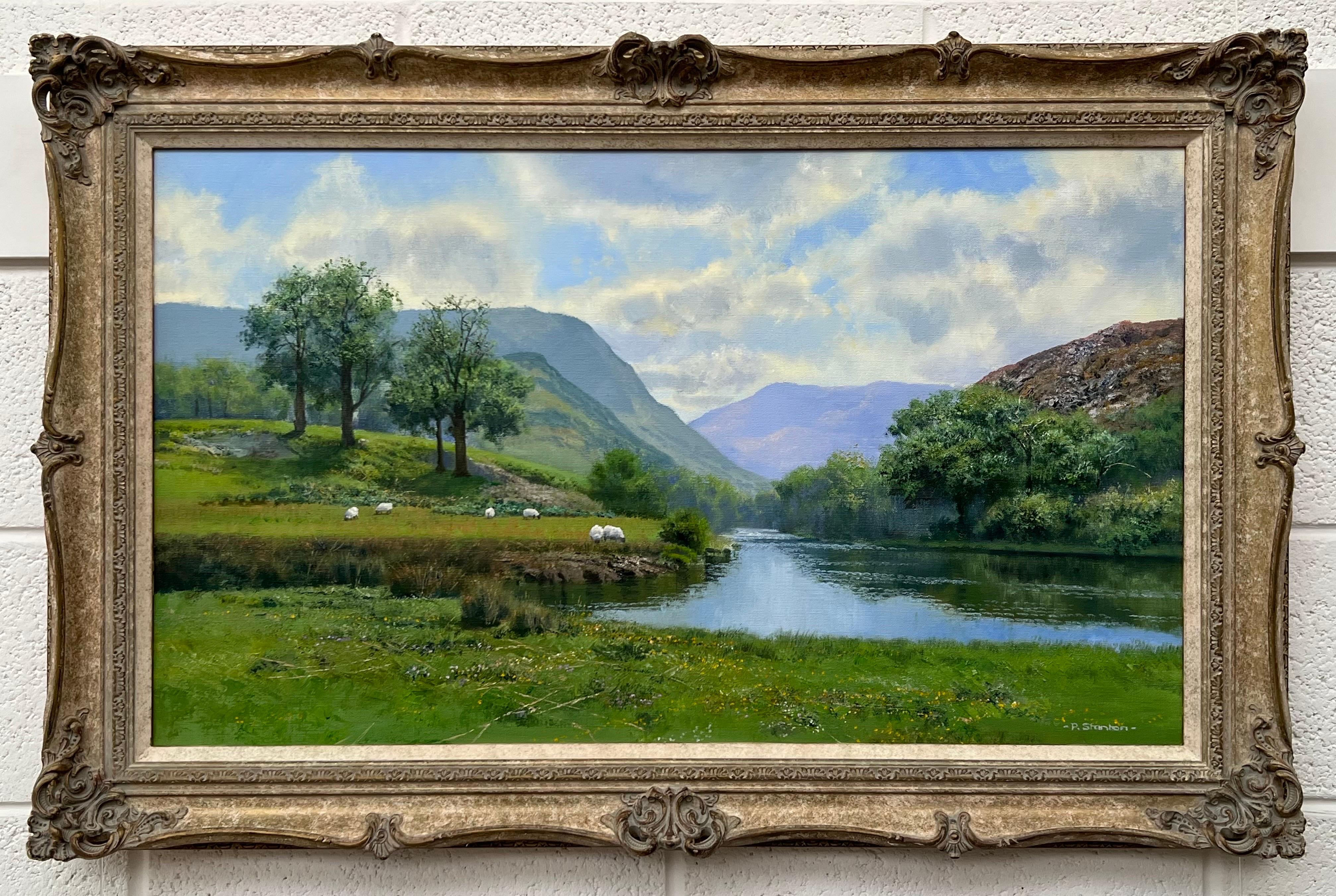 Lush Green River Landscape Painting of the English Countryside with Sheep in the Fields and Mountains in the Background, by British Artist, Philip Stanton. This is a high quality original, oil on canvas, in great condition and ready to hang!

Art
