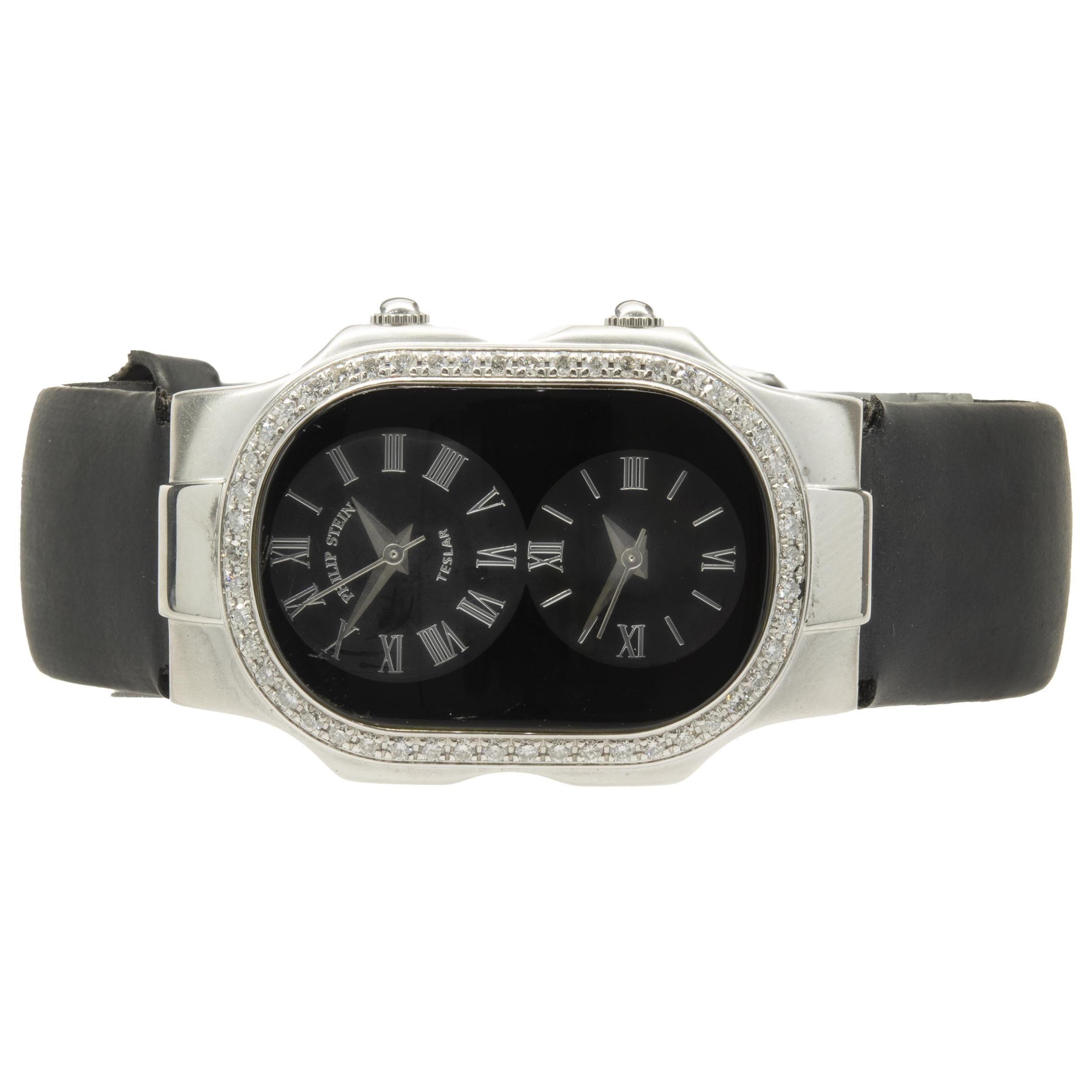 Movement: quartz
Function: hours, minutes, seconds, two-time zone
Case: 42mm x 27mm stainless steel case with sapphire crystal, diamond bezel, stainless steel winding crowns, water resistant to 30 meters
Band: black rubber strap with buckle
Dial: