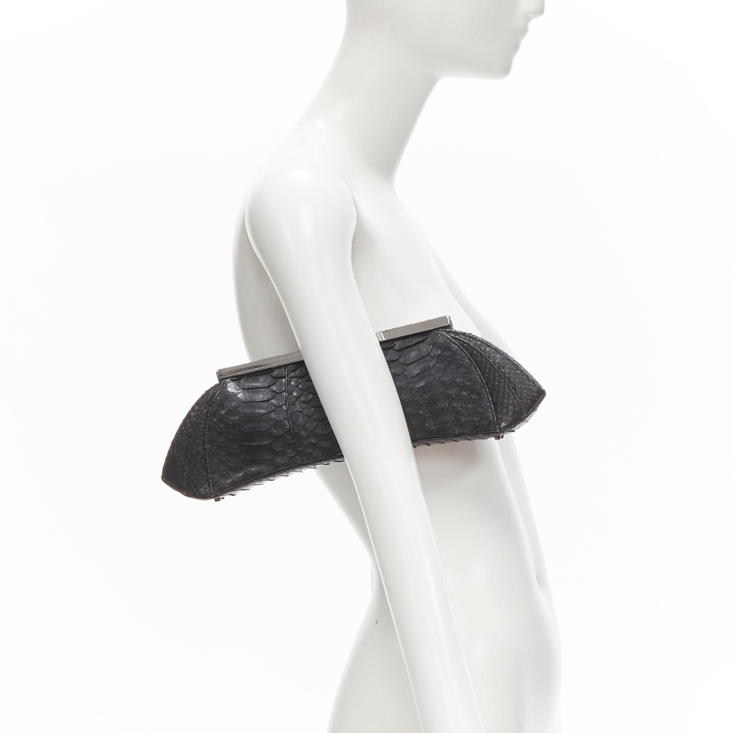 PHILIP TREACY black scaled leather silver metal clasp evening clutch bag 
Reference: JACG/A00007 
Brand: Phillip Treacy 
Material: Leather 
Color: Black
Pattern: Solid 
Closure: Push lock 
Extra Detail: Scaled leather. Silver-tone hardware. Metal