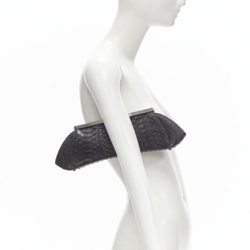 PHILIP TREACY black scaled leather silver metal clasp evening clutch bag
Reference: JACG/A00007
Brand: Phillip Treacy
Material: Leather
Color: Black
Pattern: Solid
Closure: Push Lock
Lining:  Fabric
Extra Details: Scaled leather. Silver-tone