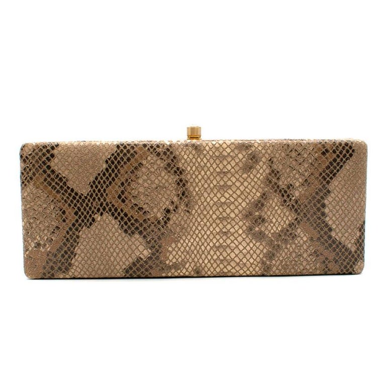 Philip Treacy Small Gold-Tone Snake Print Box Clutch 
- Gold-tone hardware and push closure
- Diamante closure
- Snake effect material 
- Fully lined
- Small compact mirror inside 
- two pockets inside 

Materials 
Snake effect fabric
Metal 

Made