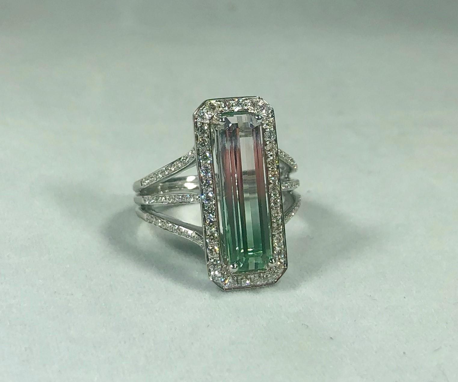 Philip Zahm 18 KT 3.64 CT Bi-color Tourmaline Diamond Dinner Ring. Afghan, 3.64 carat pink and green bi-color tourmaline, elongated emerald-cut center, set north-south (measurements 5.13 by 17.68). Diamond accents surround center stone, running down