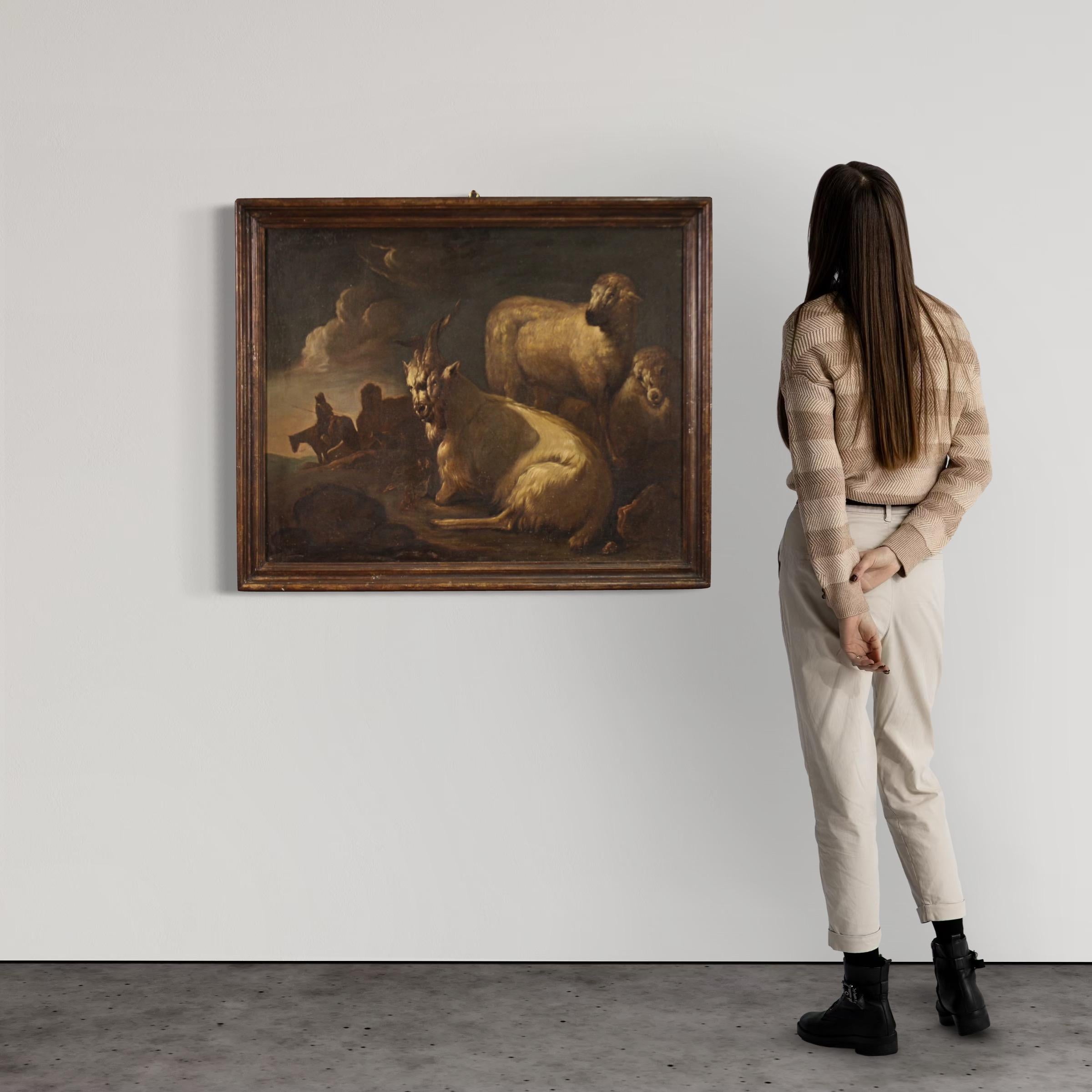 Antique Italian painting from the second half of the 17th century. Oil on canvas artwork depicting a splendid bucolic landscape with animals and a shepherd, of great pictorial quality. In the foreground we find magnificently painted goats that seem
