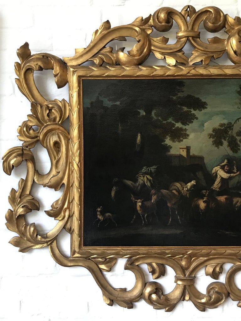 A highly decorative large, Italianate landscape dating to the mid 18th century or earlier by a follower of Philipp Peter Roos (1657-1706) called Rosa da Tivoli. It is presented in a beautiful hand carved and gilded Florentine Frame. 

Follower of