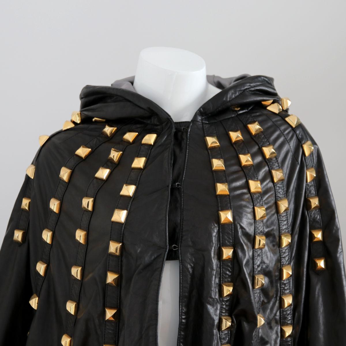 PHILIPP PLEIN

2010s. Black leather cape with hood and studs from Philipp Plein.

Buy Now Or Cry Later!

The cape is in good condition (see photos).
Minimal abrasion on the hardware.