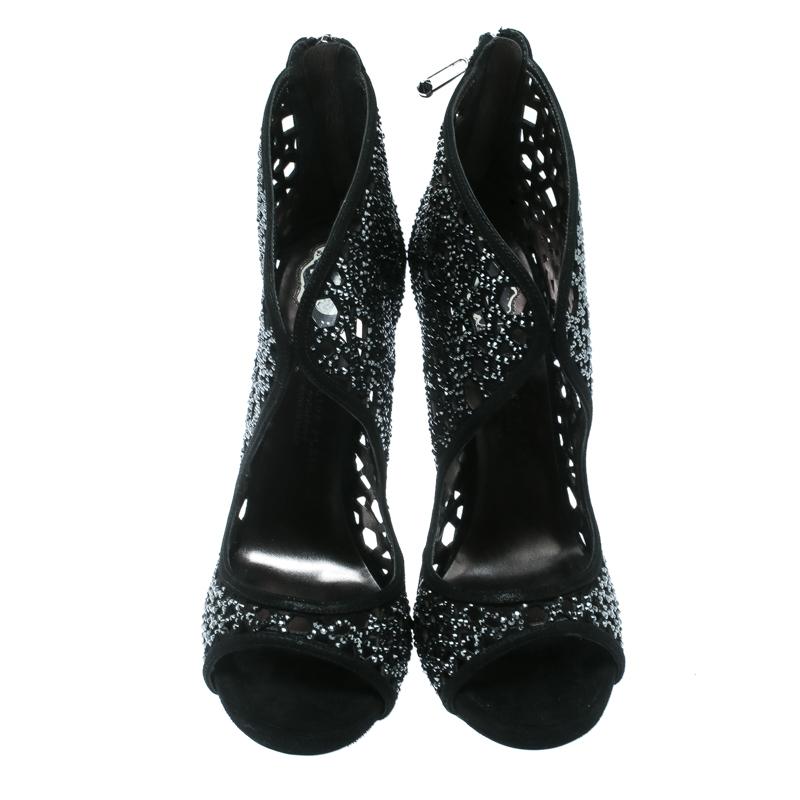 These ankle booties from Philipp Plein were made to delight the tastes of all fashion-forward ladies. The open toe booties have cutouts, back zippers, 12.5 cm heels and they are covered in crystals.

Includes: The Luxury Closet Packaging

