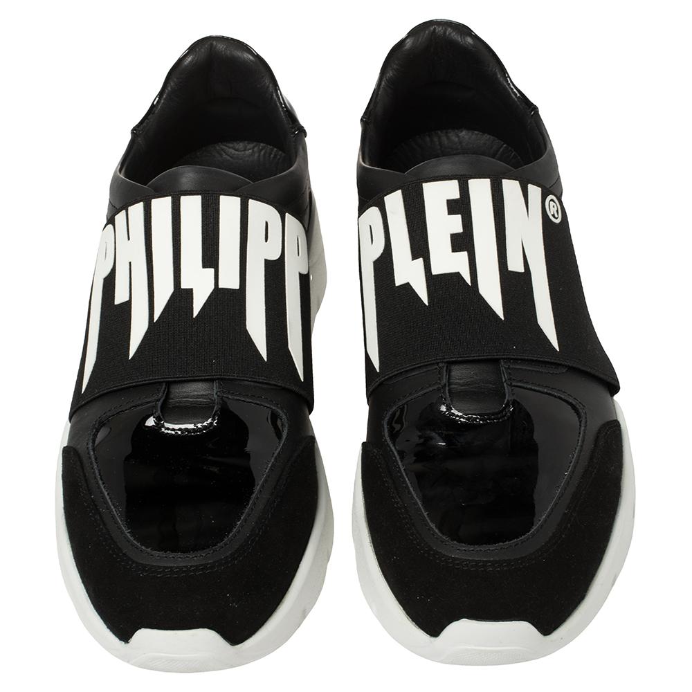 Look your stylish best every time you step out wearing these trendy Philipp Plein sneakers. Crafted from suede and leather into a round toe silhouette, these laceless kicks are adorned with vamp straps elevated by the label's name on
