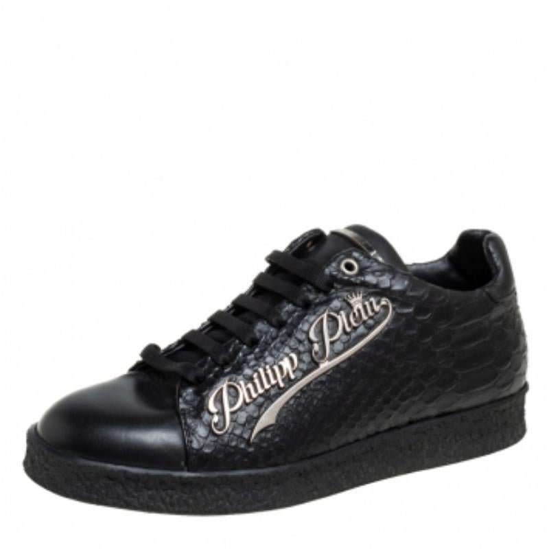 Coming with a classic low-top silhouette, these Philipp Plein sneakers are a seamless combination of luxury, comfort, and style. They are made from python-embossed leather in a black shade. These sneakers are designed with the label's name on the