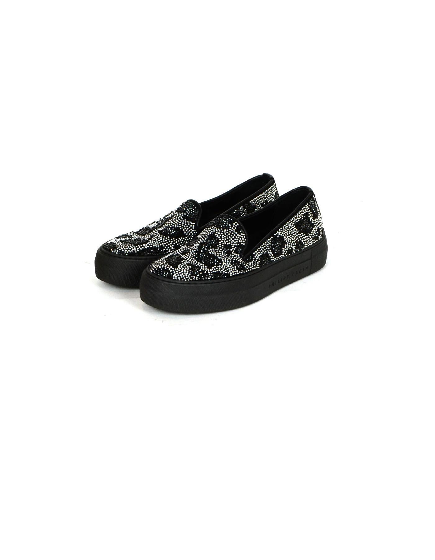 Philipp Plein Black Silver Leopard Print Crystal Sneakers sz 36

Made In: Italy
Color: Black
Hardware: Crystalline
Materials: Leather
Closure/Opening: Slip on
Overall Condition: Excellent pre-owned condition, light scratches along the bottom and the