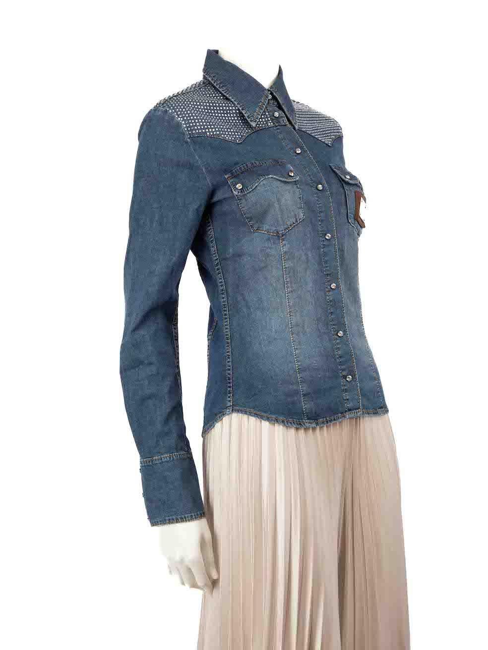 CONDITION is Very good. Minimal wear to the shirt is evident. Missing rhinestones on the right shoulder on this used Philipp Plein designer resale item.
 
 
 
 Details
 
 
 Blue
 
 Denim
 
 Shirt
 
 Snap button fastening
 
 Crystal embellished