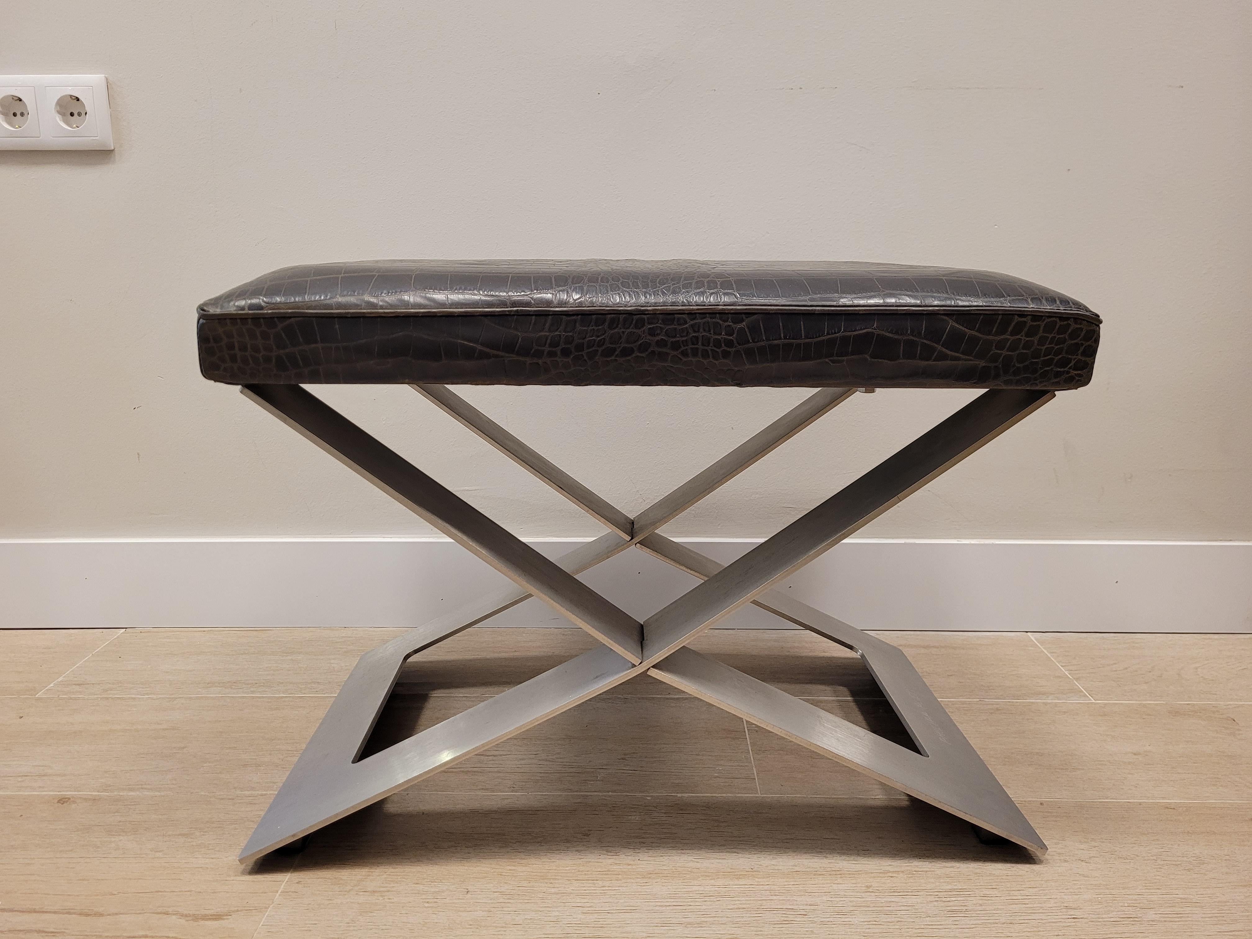 Philipp Plein (Munich, February 16, 1978) is a German fashion designer.
Gorgeous  bench or footrest in chocolate-coloured leather with crocodile effect. Blade-shaped feet in polished steel. Design by the renowned German designer Philipp Plein.