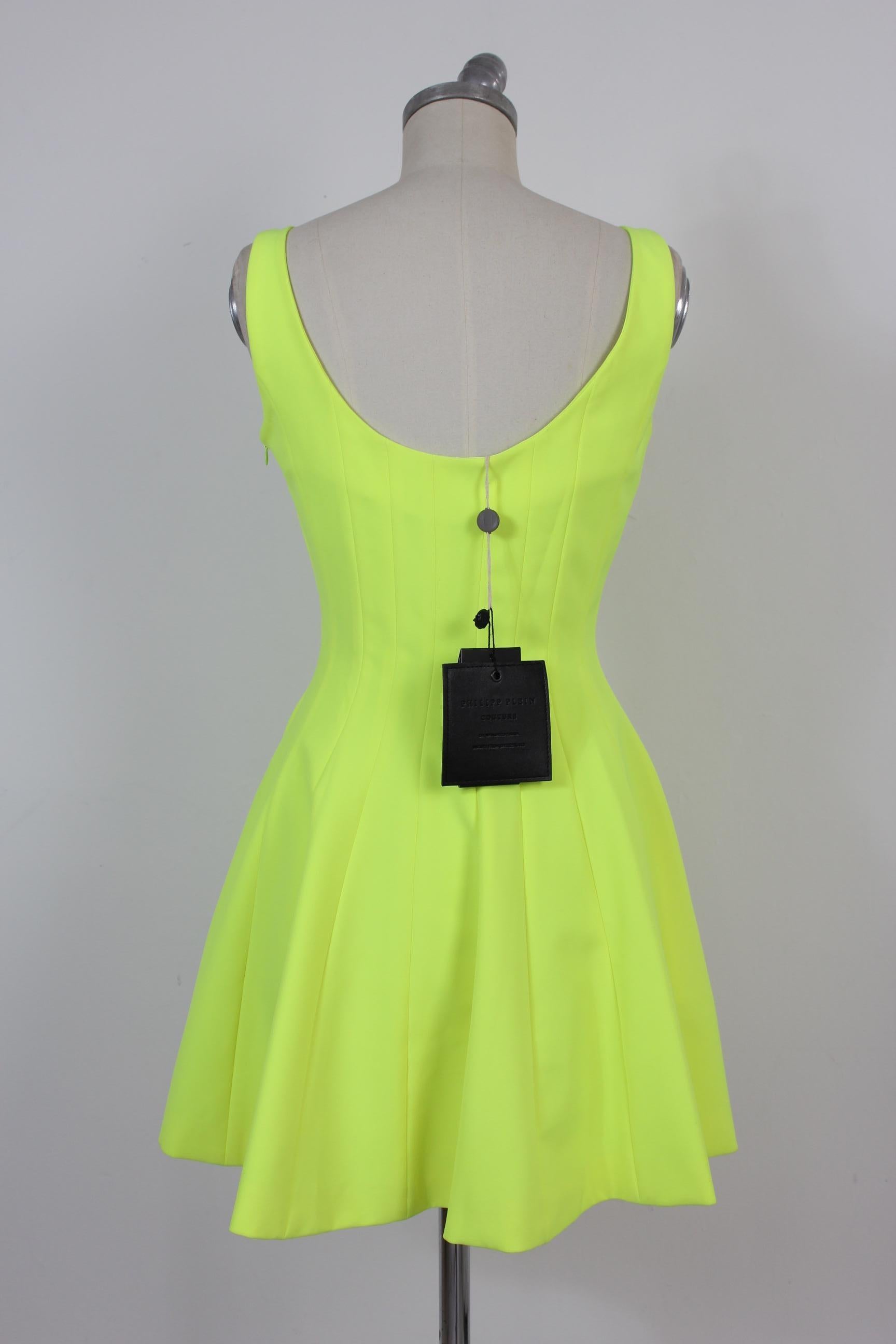 Philipp Plein Couture women's dress 2000s. Elegant dress embellished with colored stones on the decollete. Wide neckline on the back. Flared skirt. Fluo yellow color. 96% polyester 4% elastene. Lined interior 100% nylon. Made in Italy. New with tag,