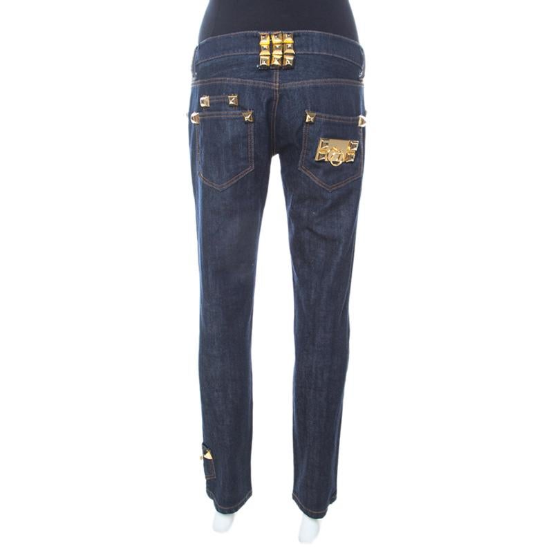 These limit edition indigo jeans come from the house of Philip Plein. The fitted light wash jeans are tailored from cotton and are adorned with gold-tone rockstud embellishments. With six external pockets and zip closure, it is complete.

