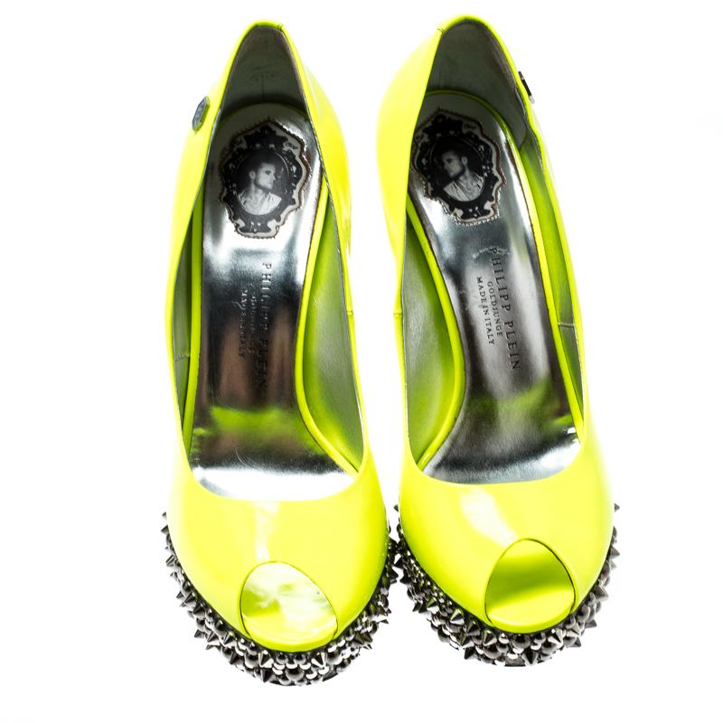 A pair of pumps to lend your outfit that edge on days when you wish to make a fashion statement. The pumps are by Philipp Plein and they are gorgeous! The neon leather exterior and the spikes on the platforms and 13.5 cm heels are sure to catch