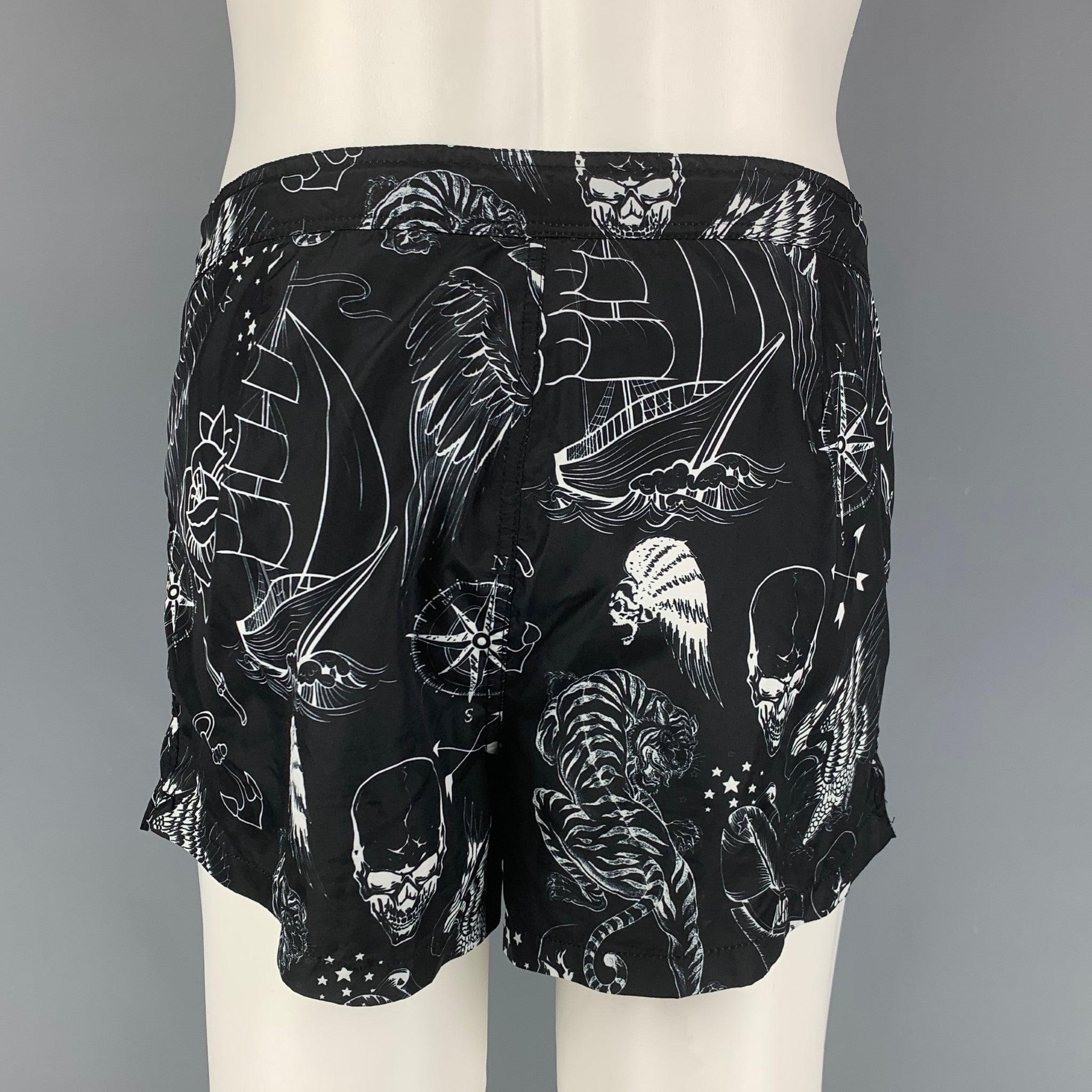 PHILIPP PLEIN shorts comes in a black & white print polyamide featuring a drawstring detail and a zip fly closure. Made in Italy.Very Good
Pre-Owned Condition. 

Marked:   M  

Measurements: 
  Waist: 32 inches  Rise: 11 inches  Inseam: 2.5 inches 
