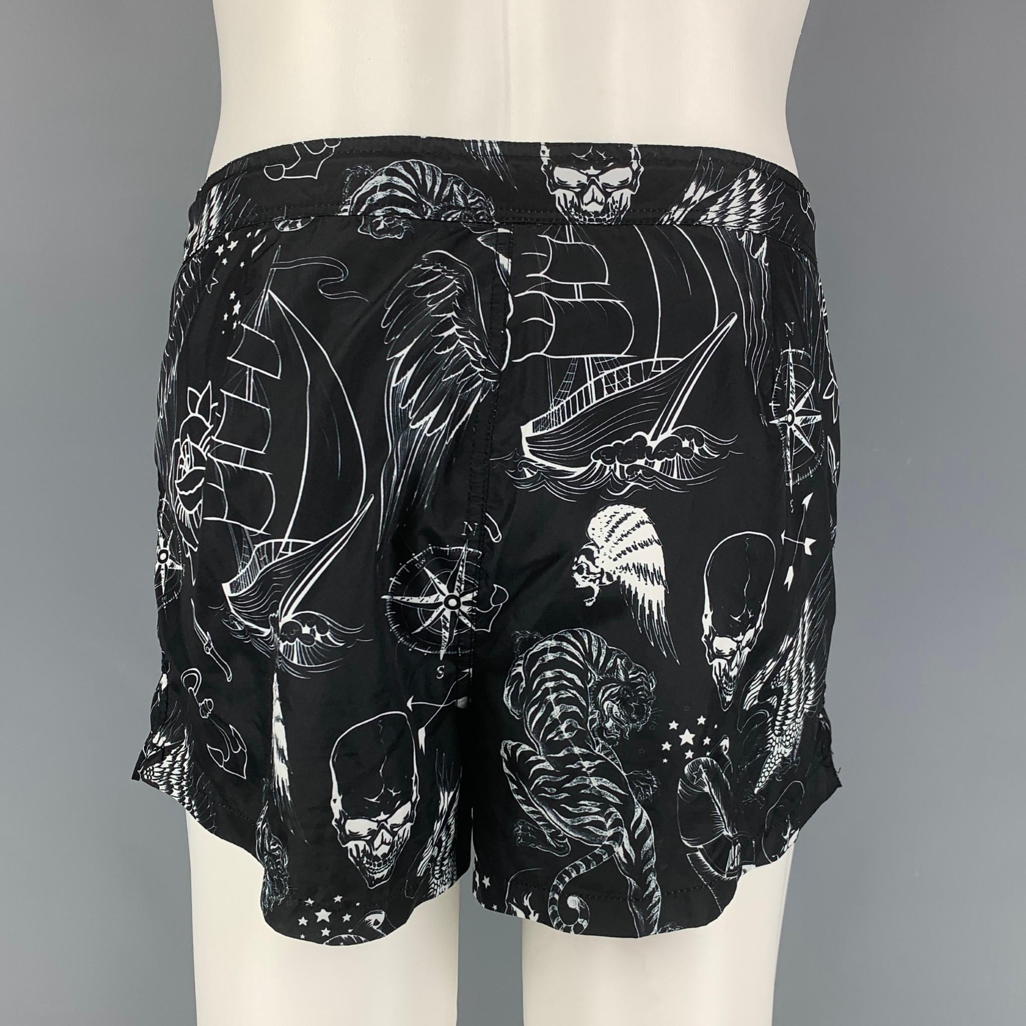 PHILIPP PLEIN shorts comes in a black & white print polyamide featuring a drawstring detail and a zip fly closure. Made in Italy.

Very Good Pre-Owned Condition.
Marked: M
Original Retail Price : $460.00

Measurements:

Waist: 32 in.
Rise: 11
