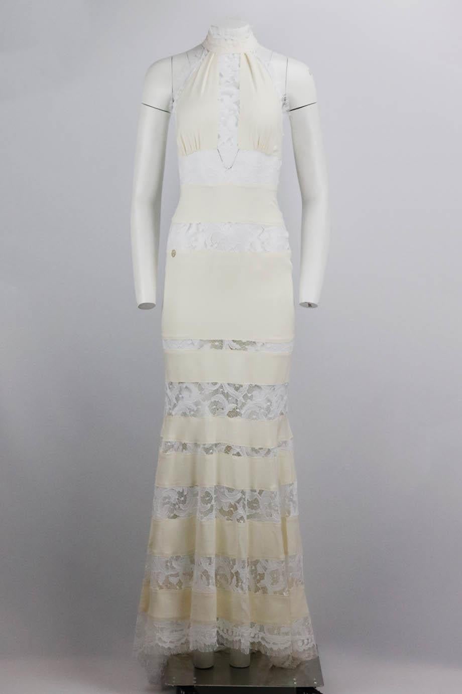 Philipp Plein tiered lace and crepe maxi dress. Ivory. Sleeveless, turtleneck. Zip fasteni50% Silk, 40% viscose, 10% polyester. Size: Small (UK 6, US 2, FR 34, IT 38). Bust: 28 in. Waist: 24 in. Hips: 35 in. Length: 61 in
